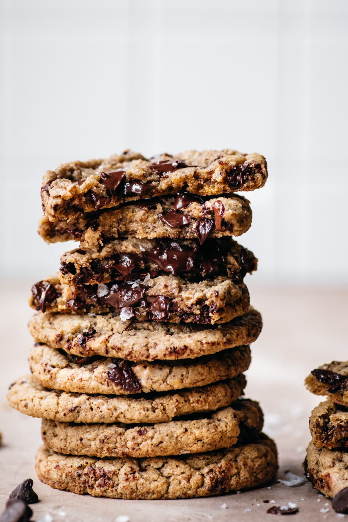 close up view of a big stack of freshly baked gluten free and vegan chocolate chip cookies. 