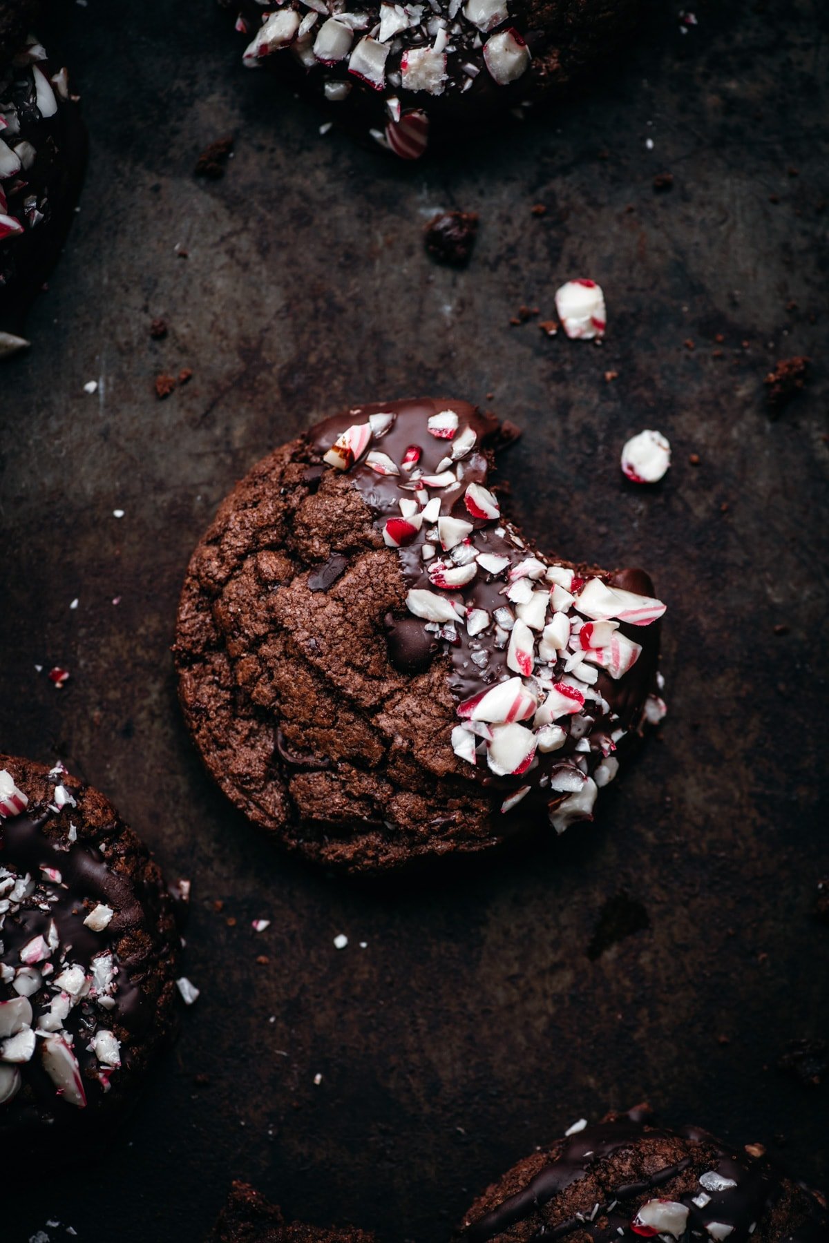 close up view of vegan chocolate peppermint cookie with bite taken out. 