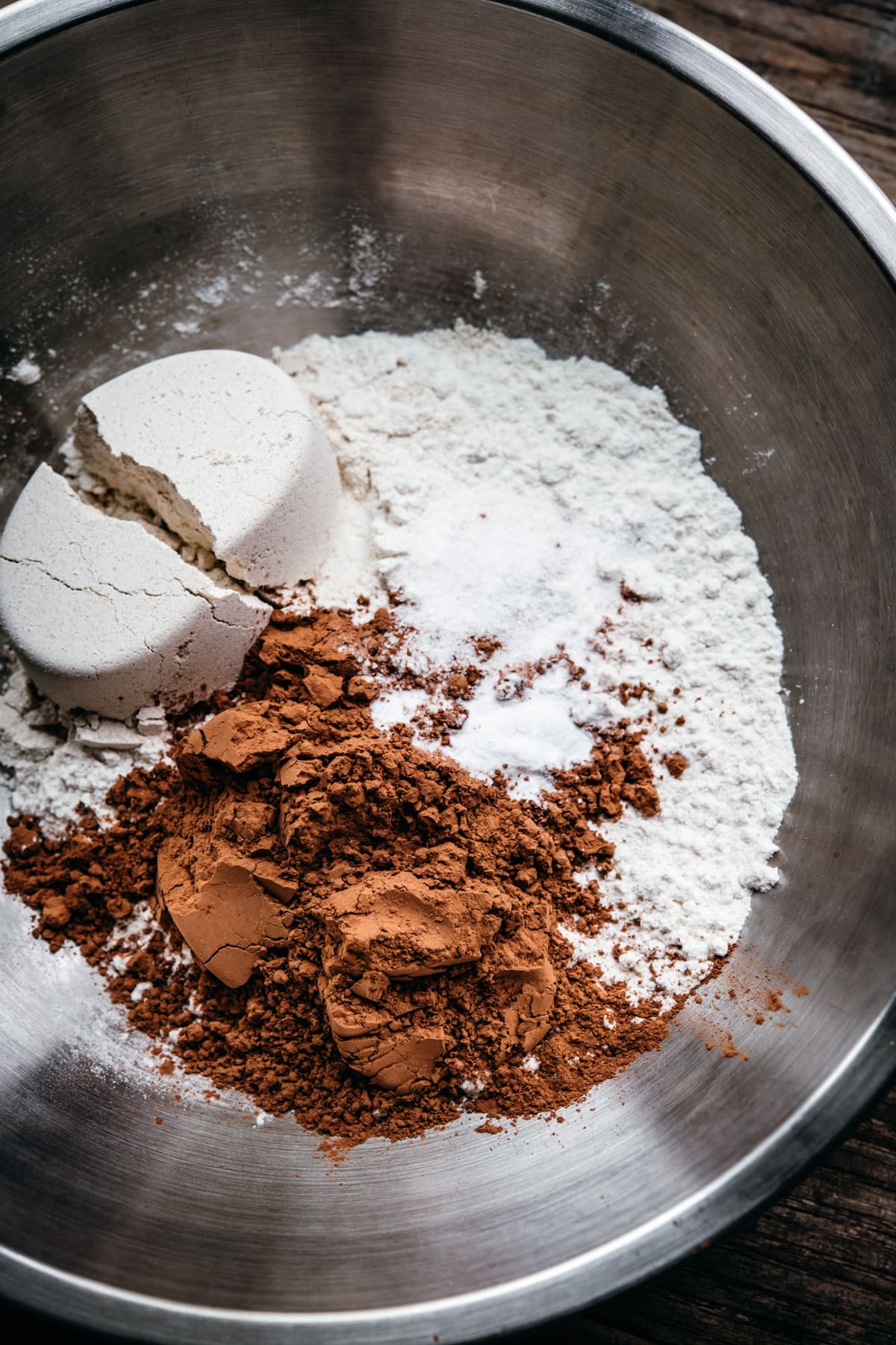 close up view of dry ingredients in bowl for vegan chocolate cookies. 