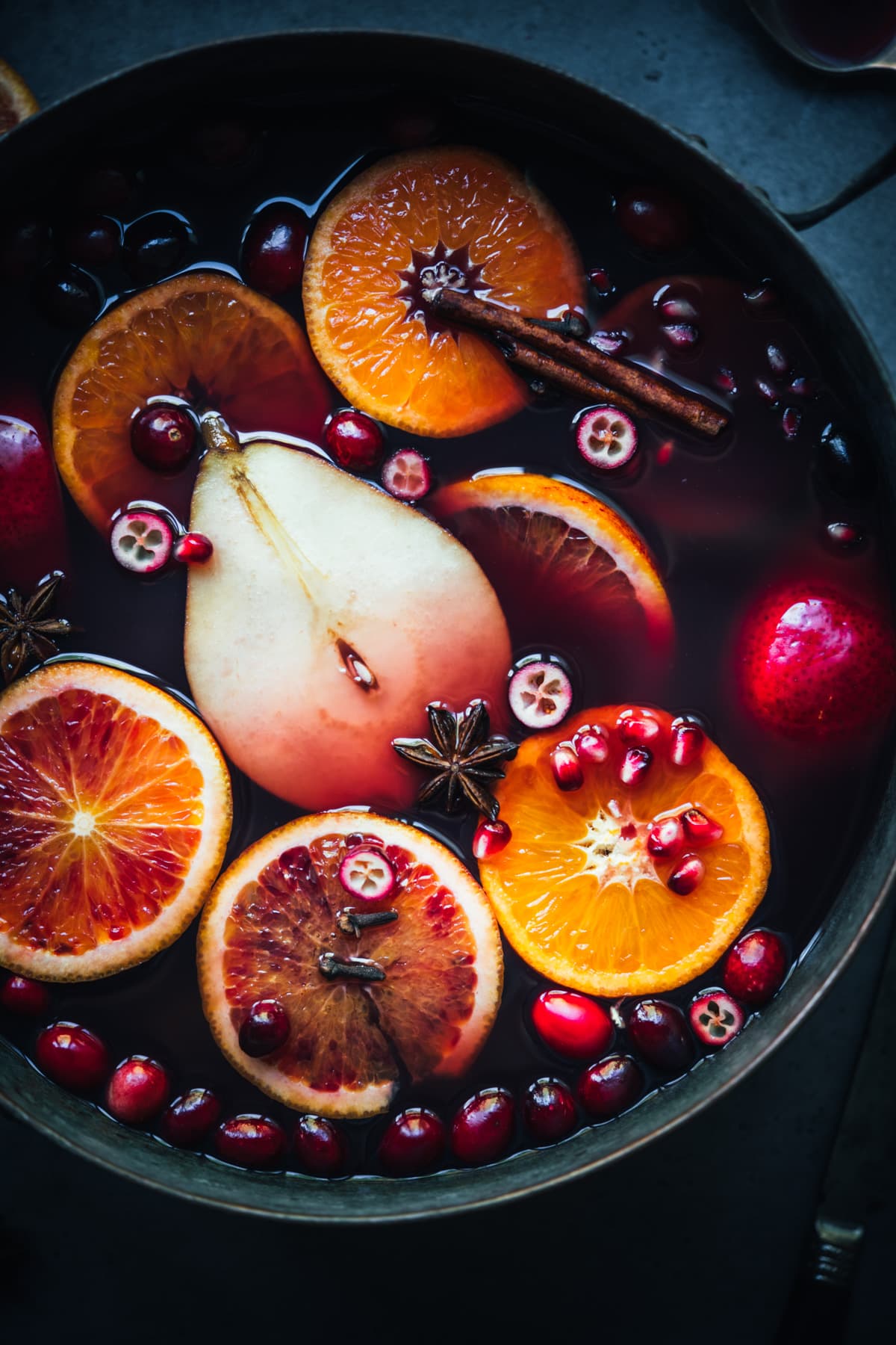 close up view of mulled wine in a large pot. 