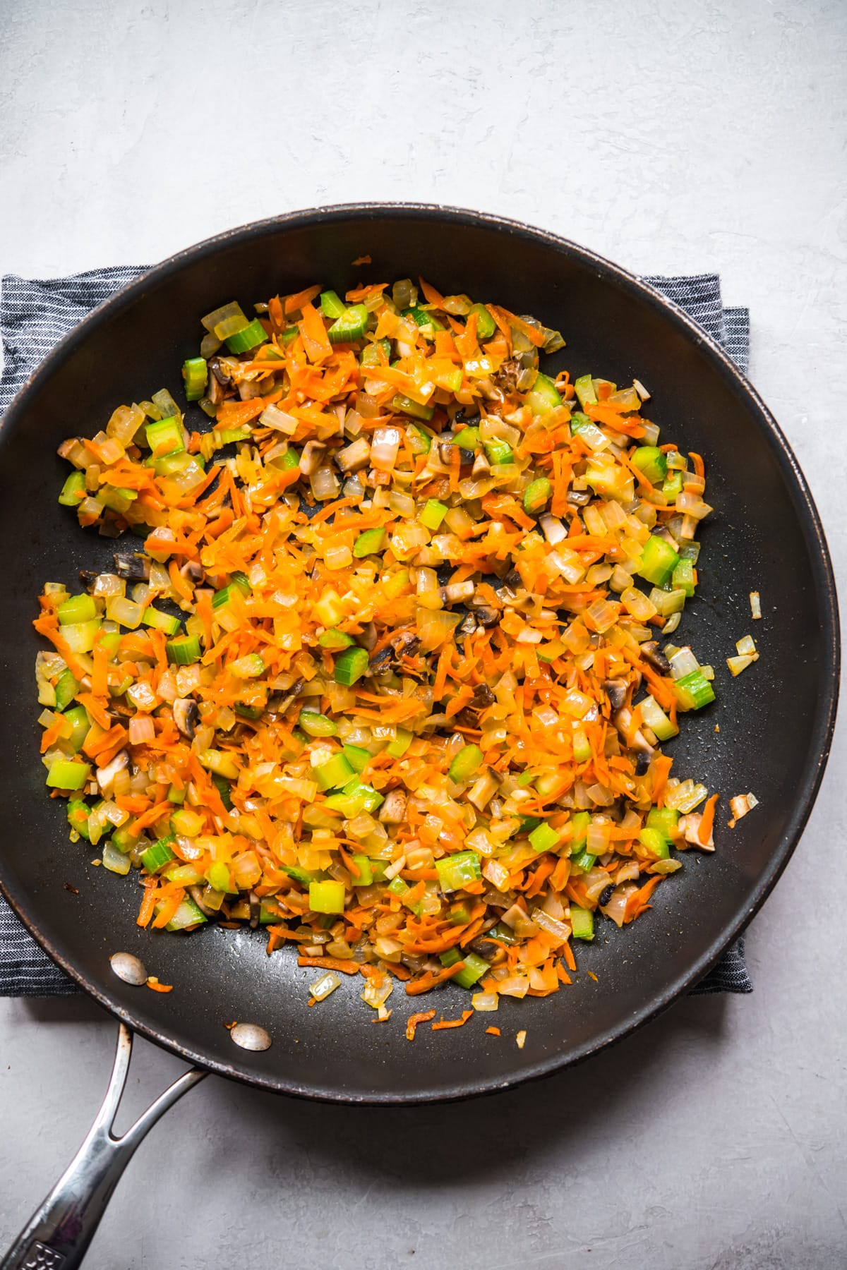 overhead view of sautéed vegetables in a skillet.