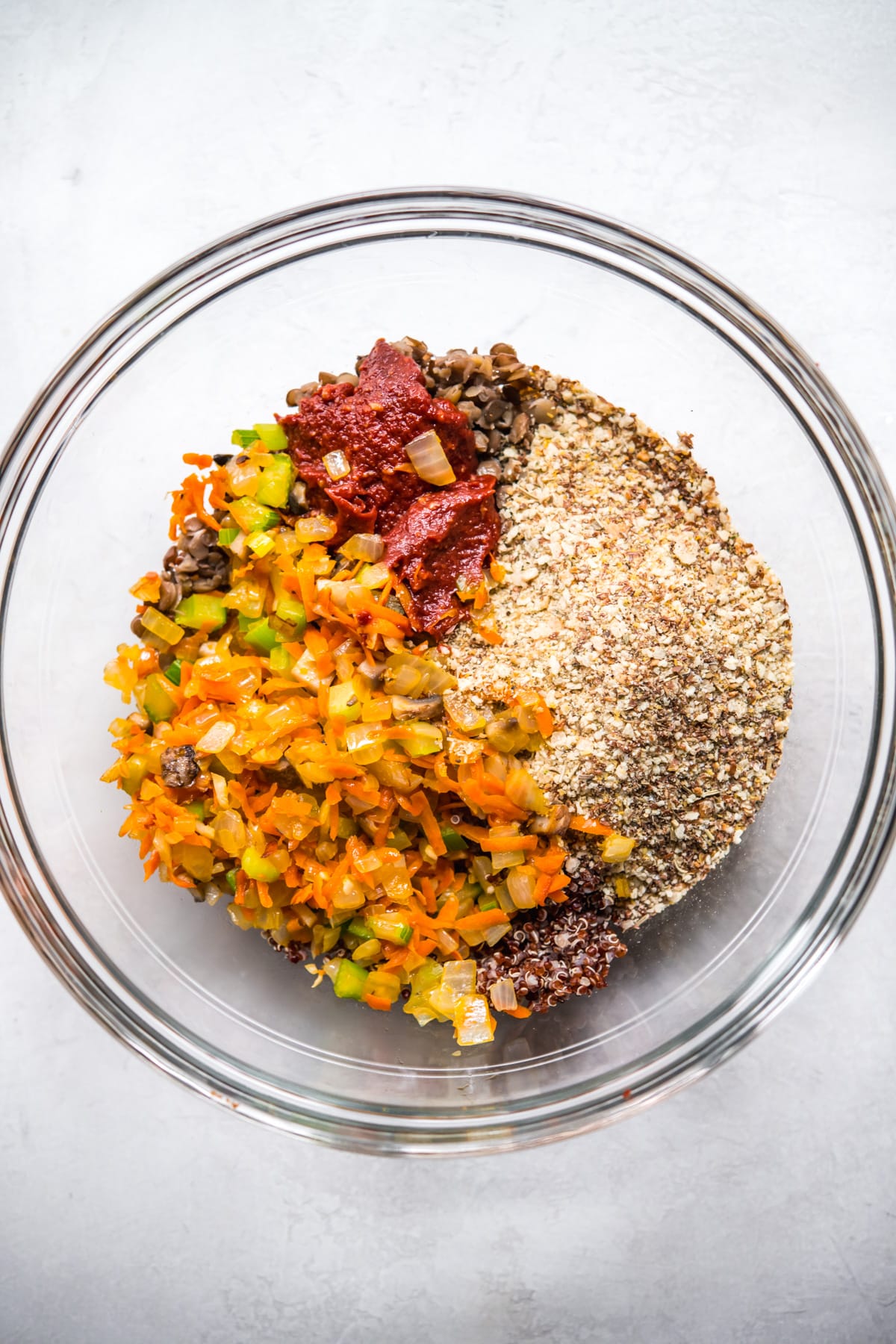 Glass bowl with ingredients for vegan meatloaf, unmixed. 