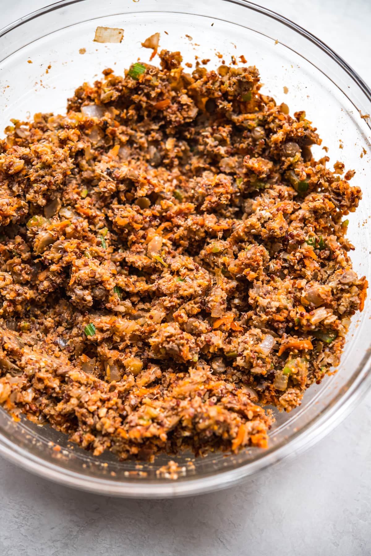 Glass bowl with ingredients for vegan meatloaf, mixed. 