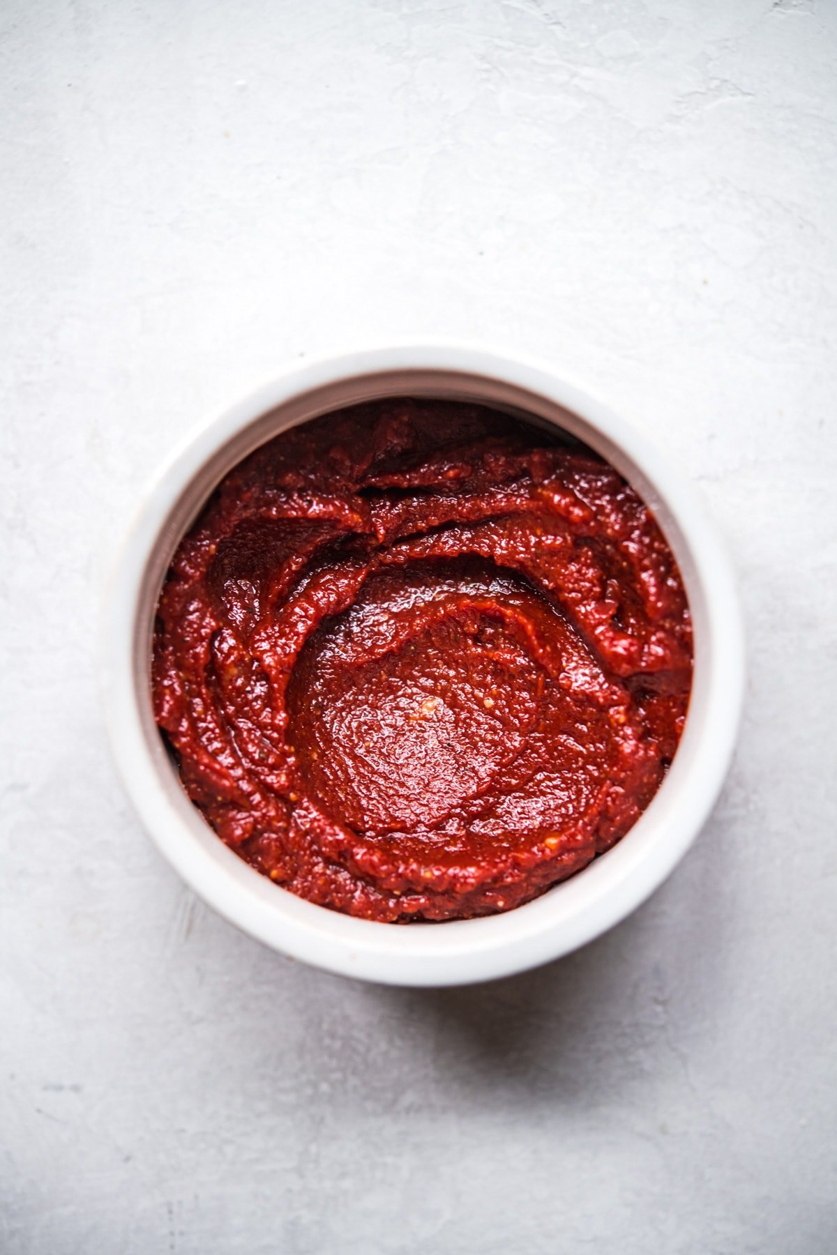 close up view of miso tomato glaze for meatloaf in a small bowl. 