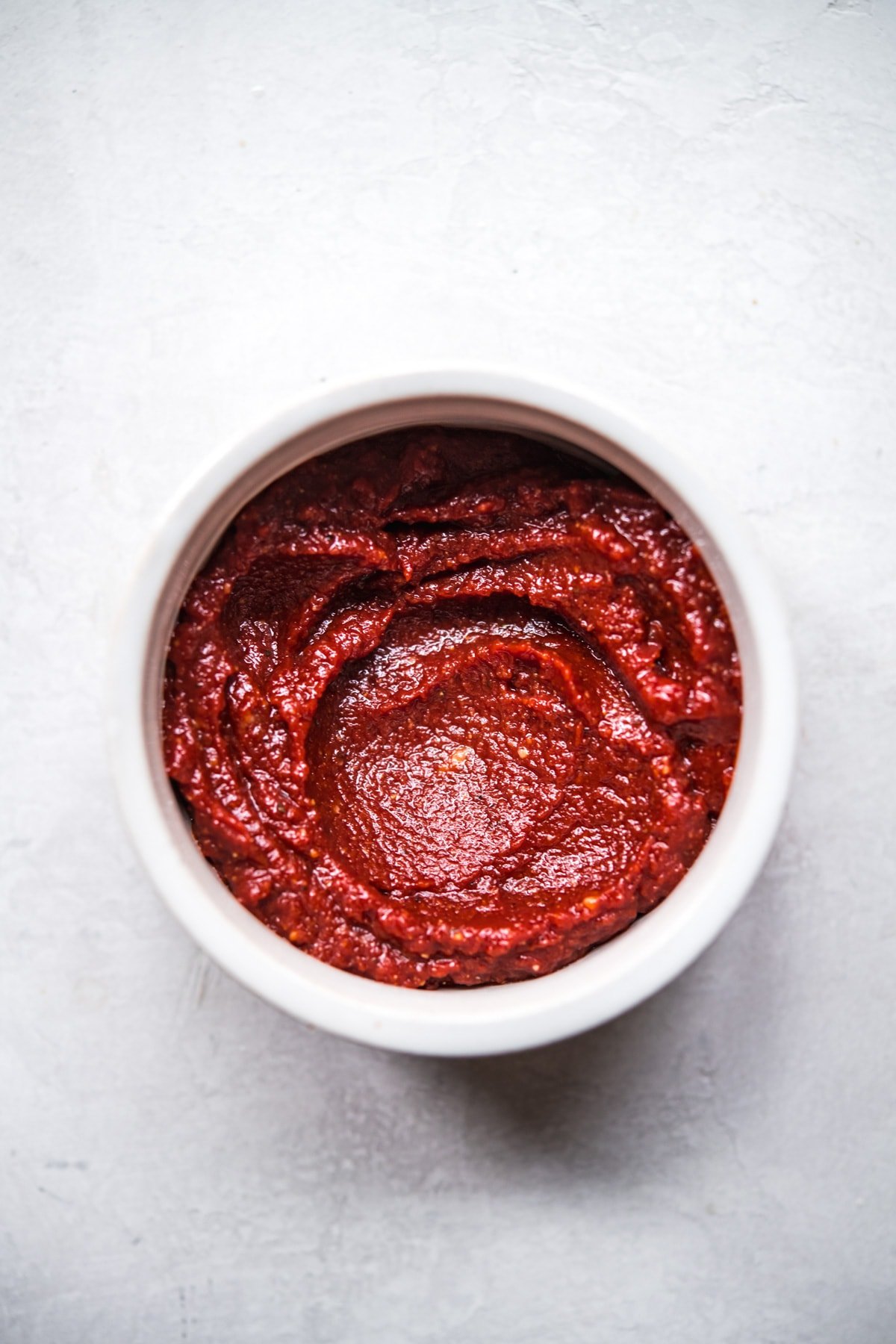 close up view of miso tomato glaze for meatloaf in a small bowl. 