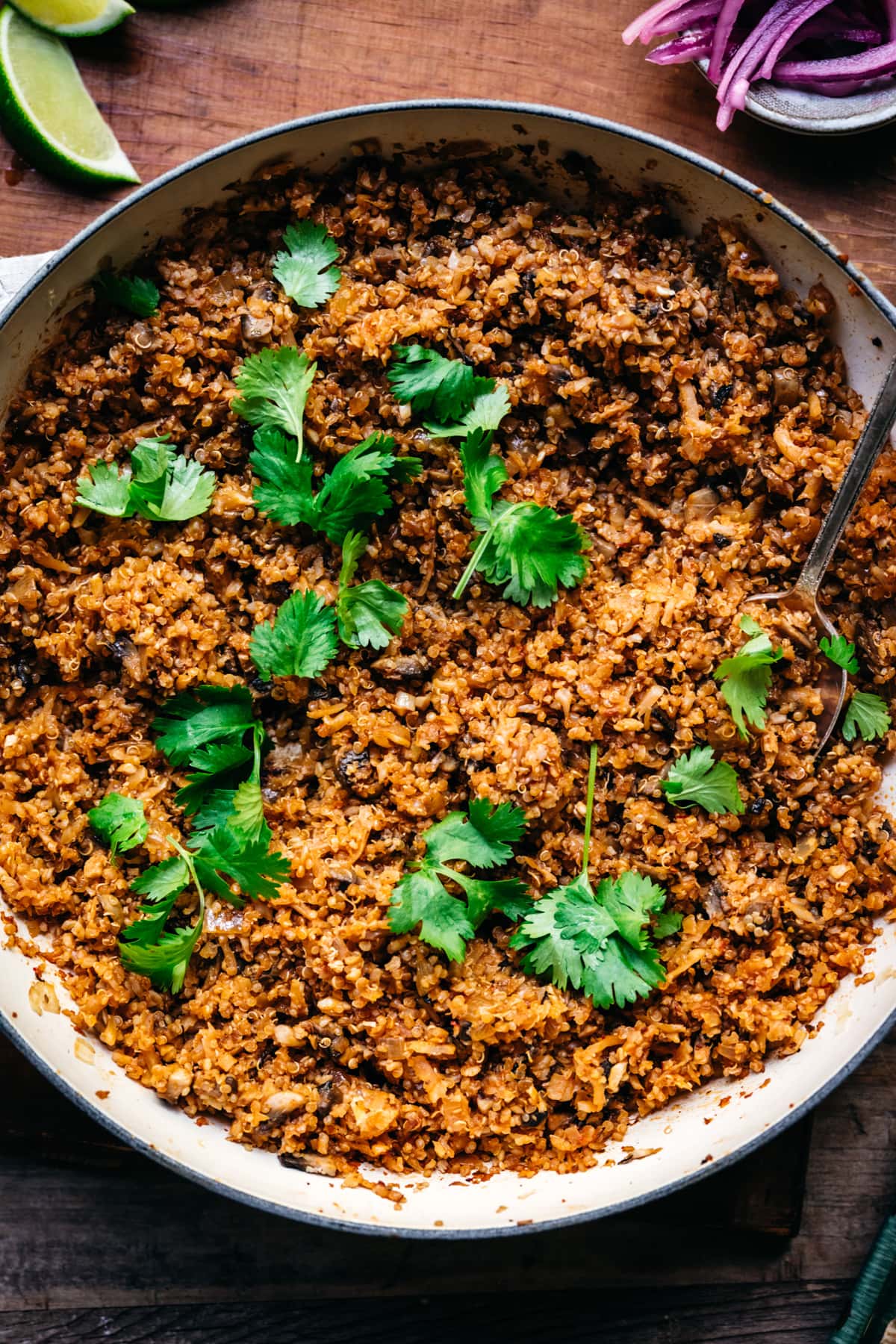 overhead view of vegan taco meat in a large pan garnished with cilantro. 