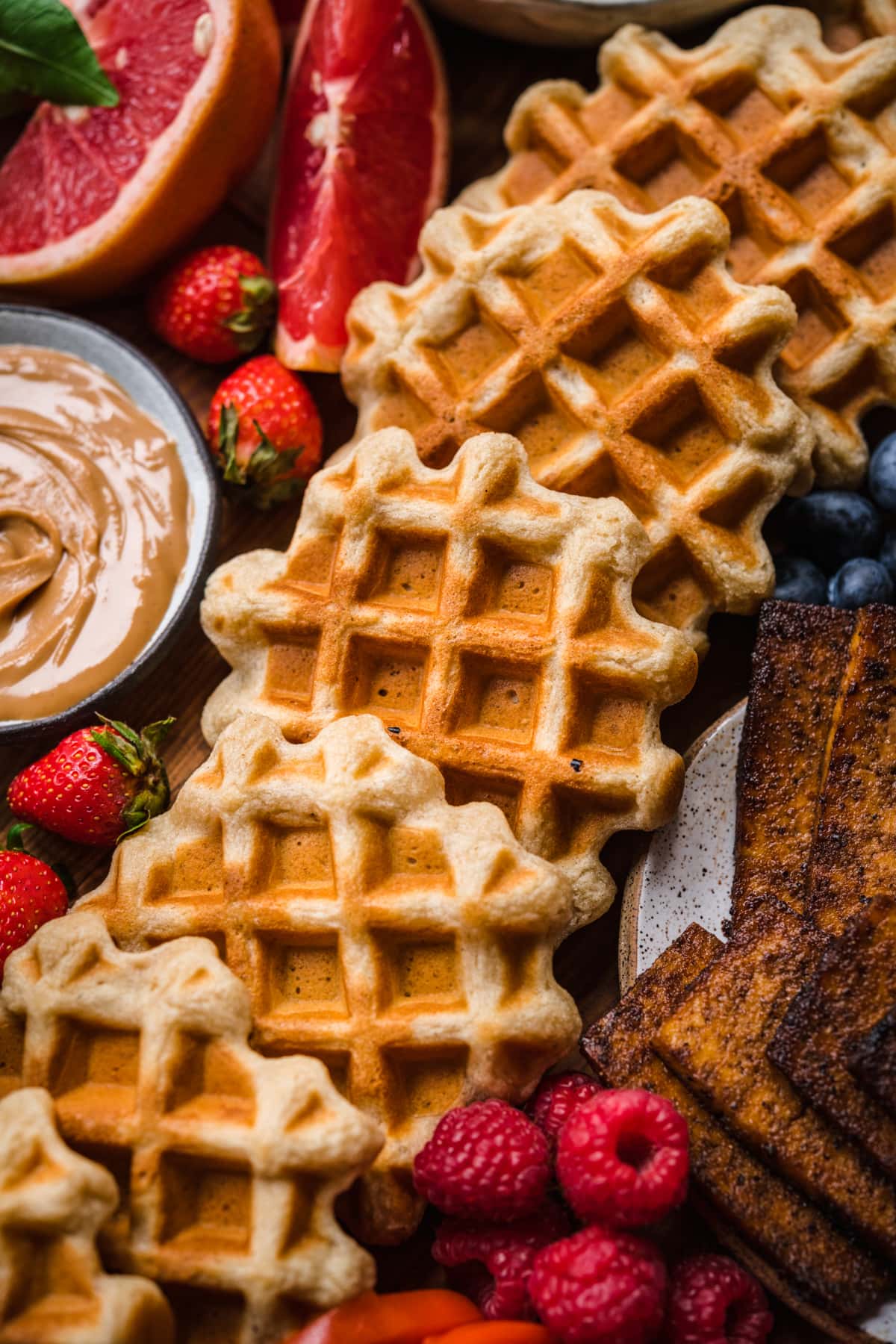 close up view of waffles on waffle board.