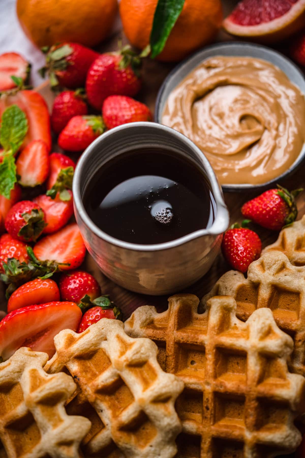 close up view of maple syrup in pouring container. 