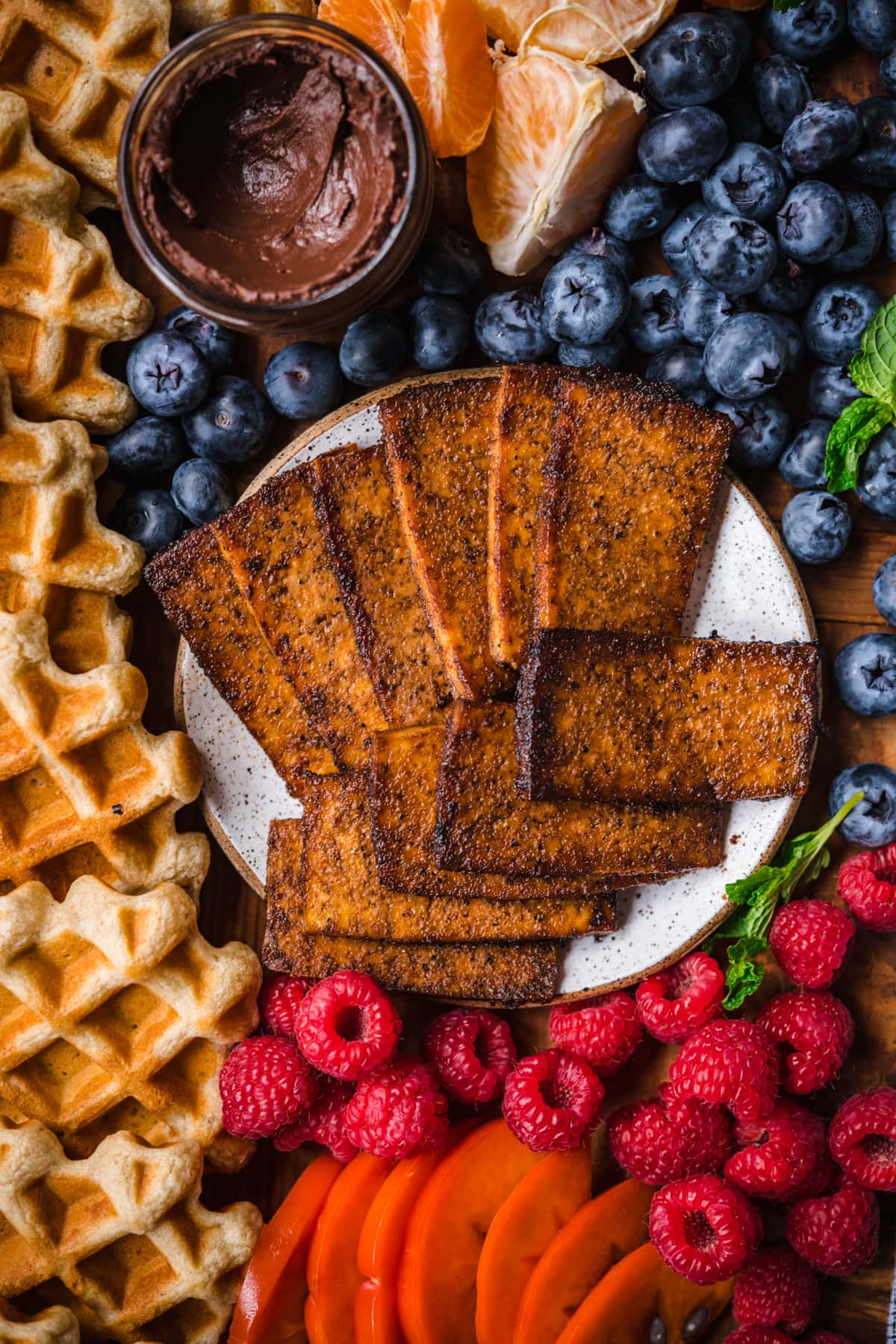 overhead view of tofu bacon on a plate.