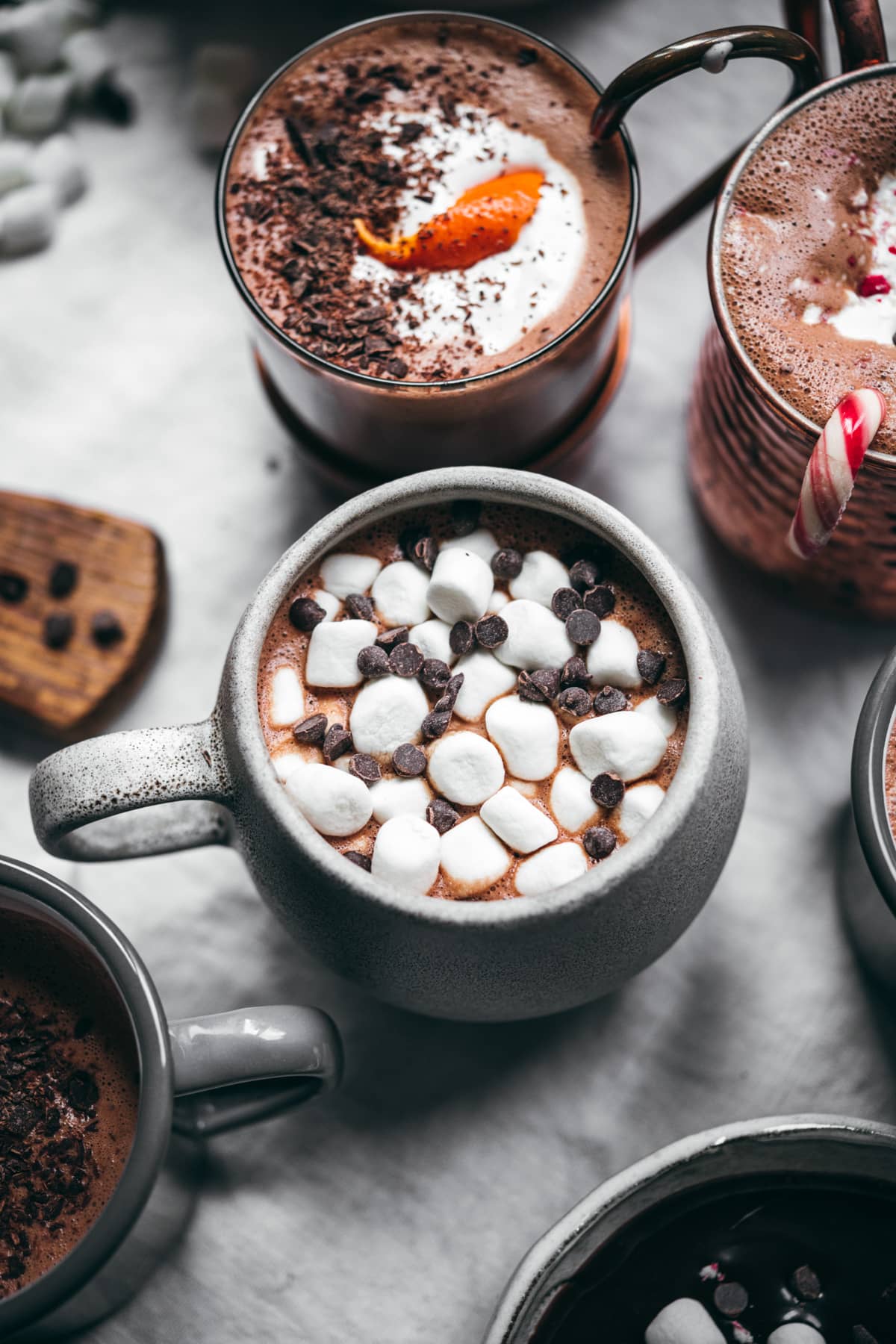 close up view of vegan hot chocolate with mini marshmallows and chocolate chips.