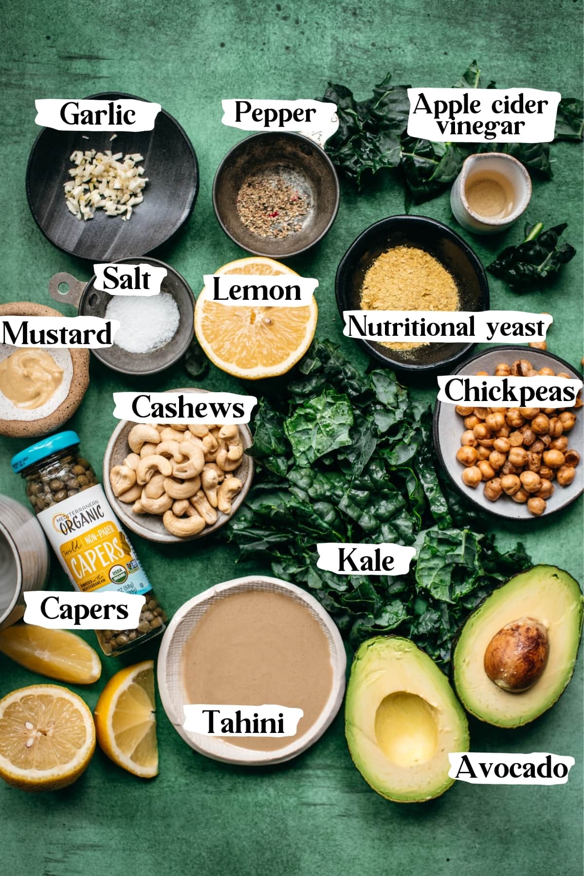 overhead view of ingredients for vegan kale caesar salad with text labels. 