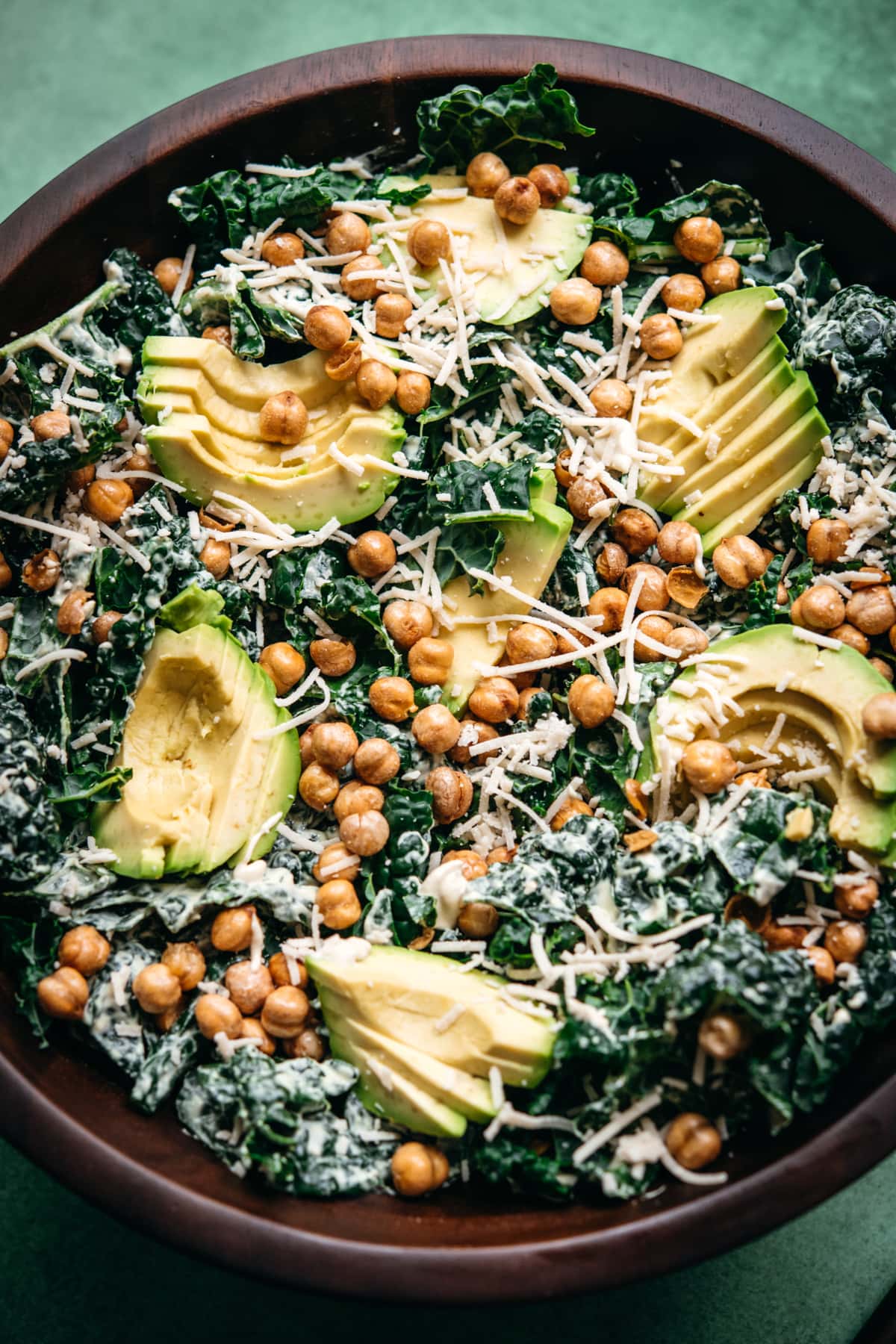 close up view of vegan kale tahini caesar salad with chickpeas. 