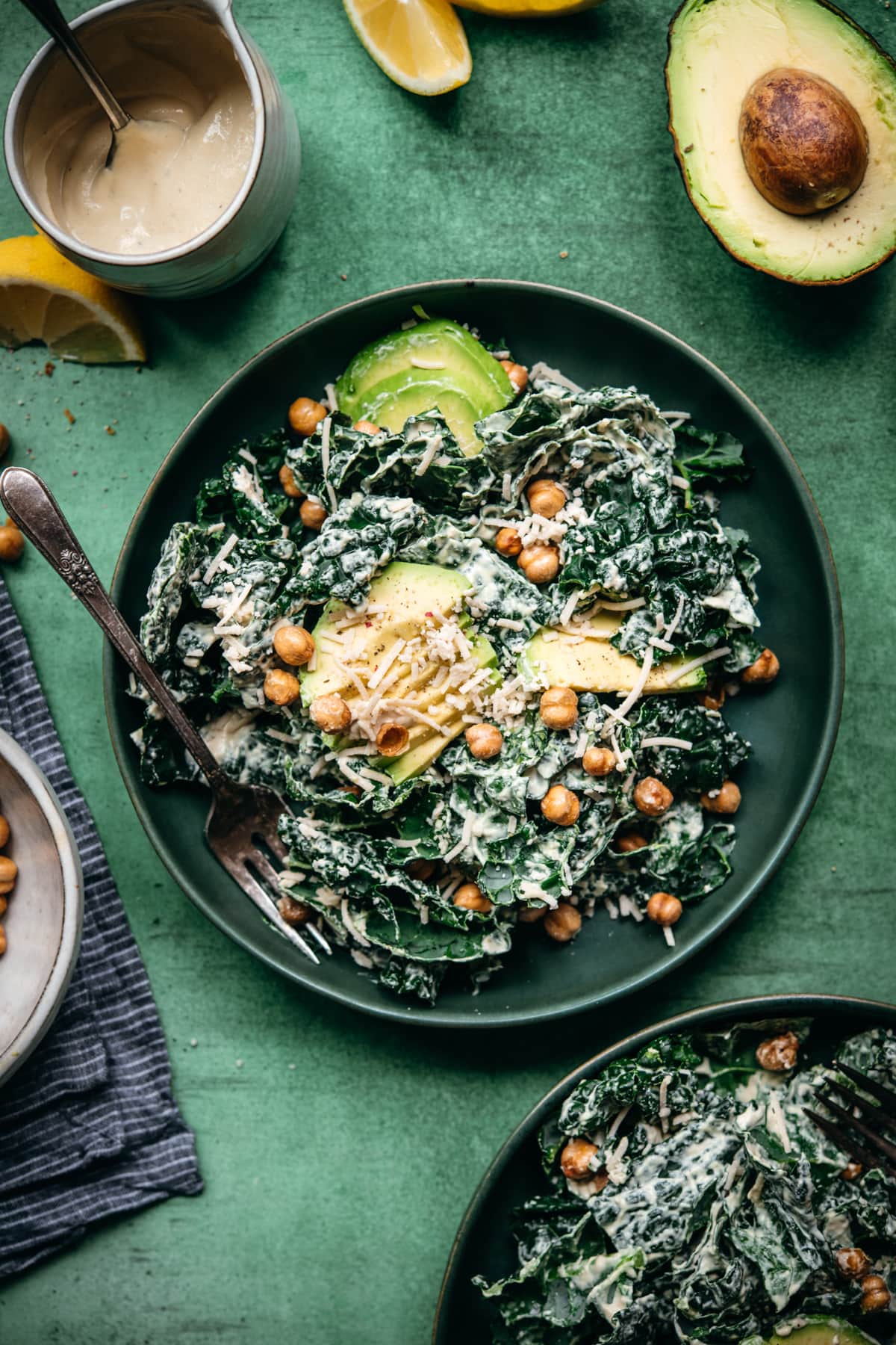 overhead view of vegan tahini caesar salad in a blue salad bowl.