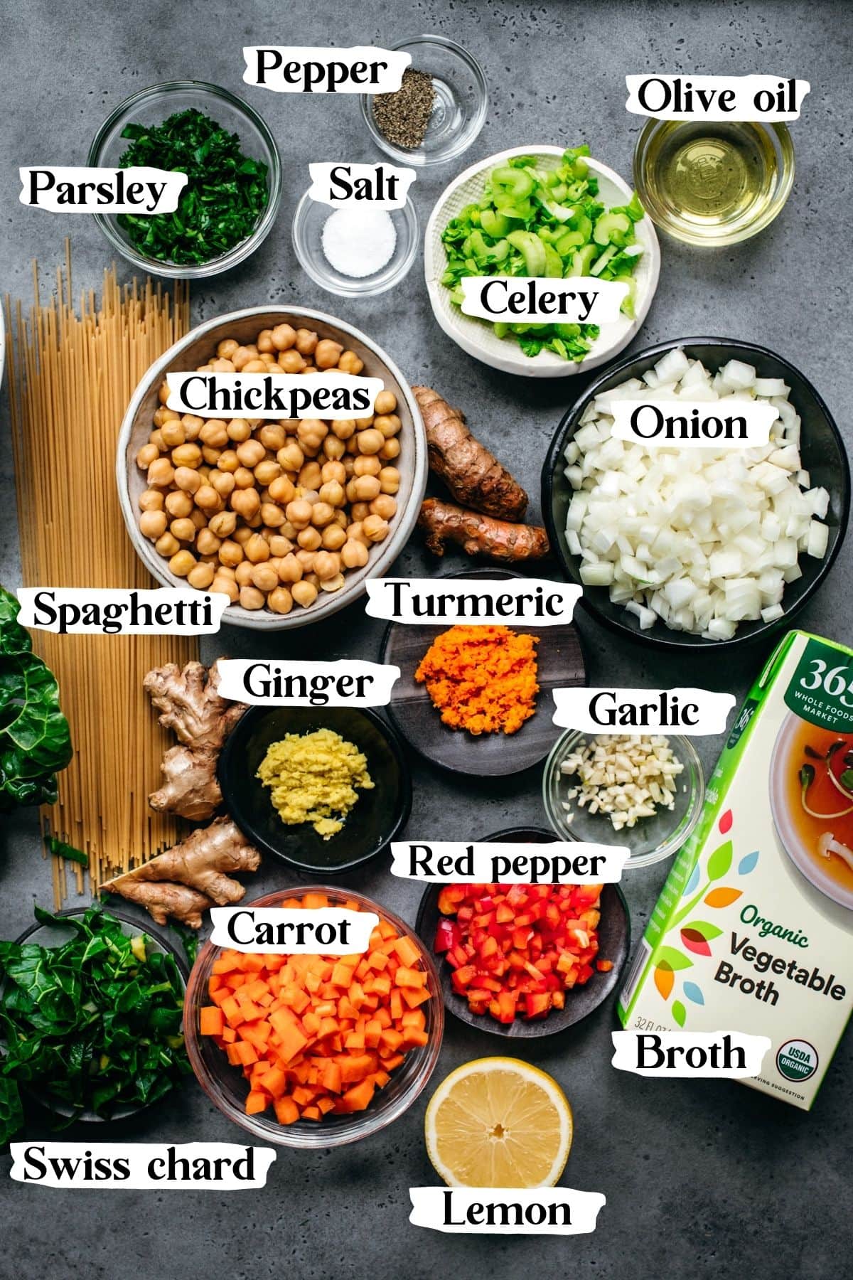 overhead view of all ingredients for immune boosting chickpea noodle soup with text labels. 