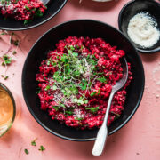 overhead view of vegan beet risotto topped with microgreens.