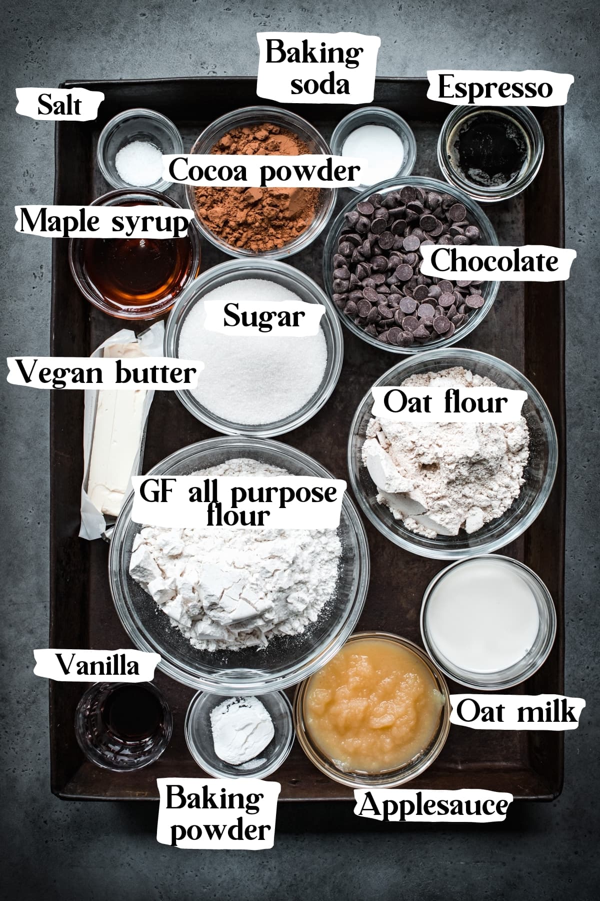 overhead view of ingredients for vegan chocolate cake with text labels. 
