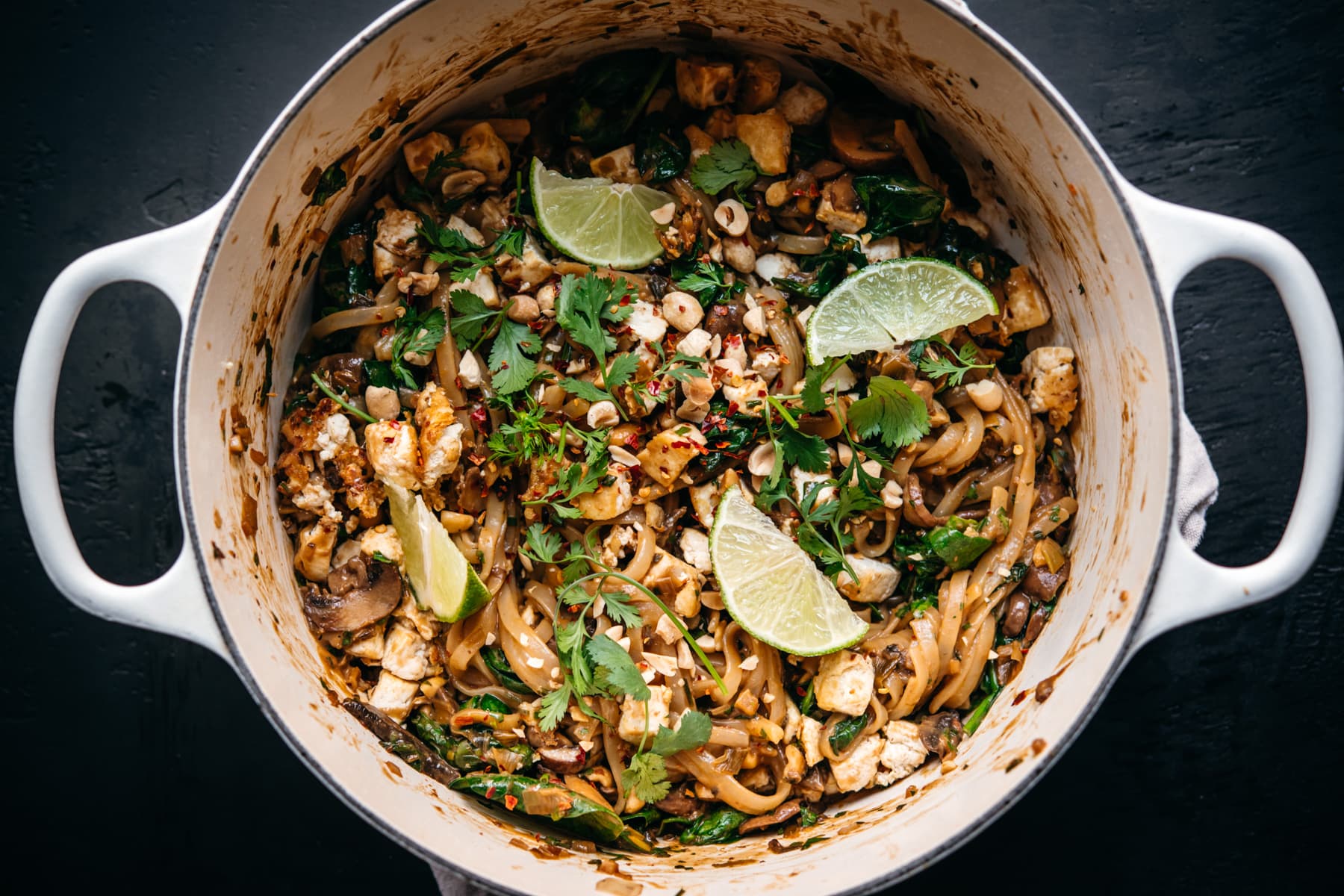overhead view of vegan pad thai in a large white pot. 