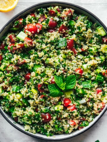 overhead view of vegan quinoa tabbouleh in a salad bowl.