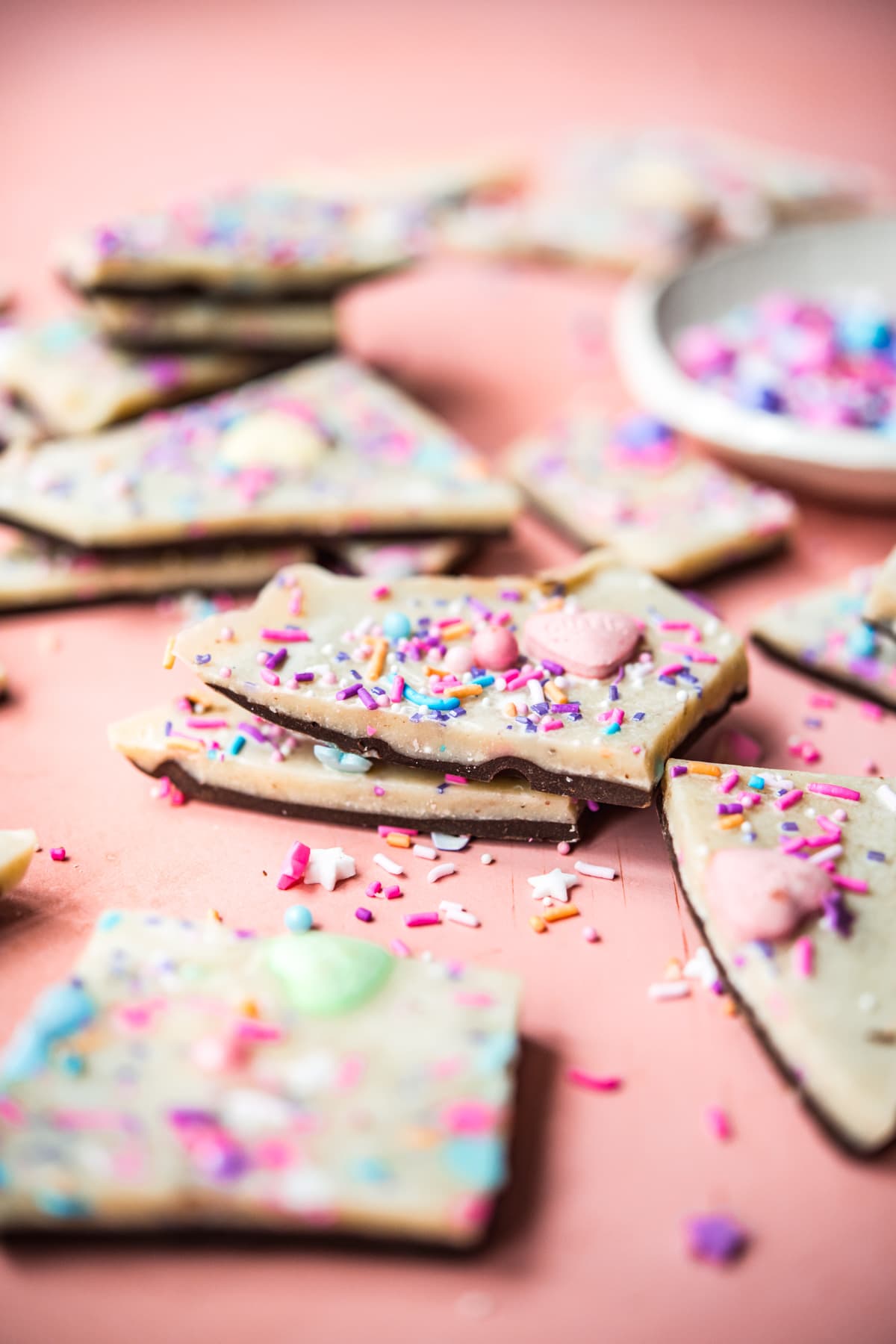 close up view of two pieces of white chocolate bark stacked.