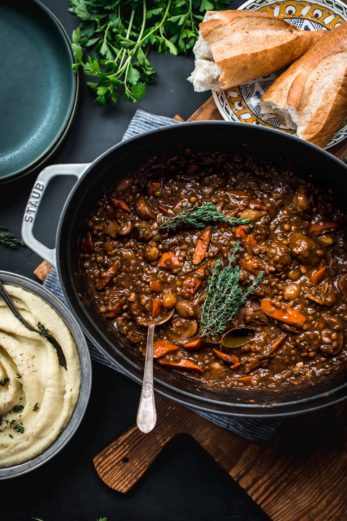 overhead view of vegan lentil and mushrooom coq au vin in a large dutch oven.