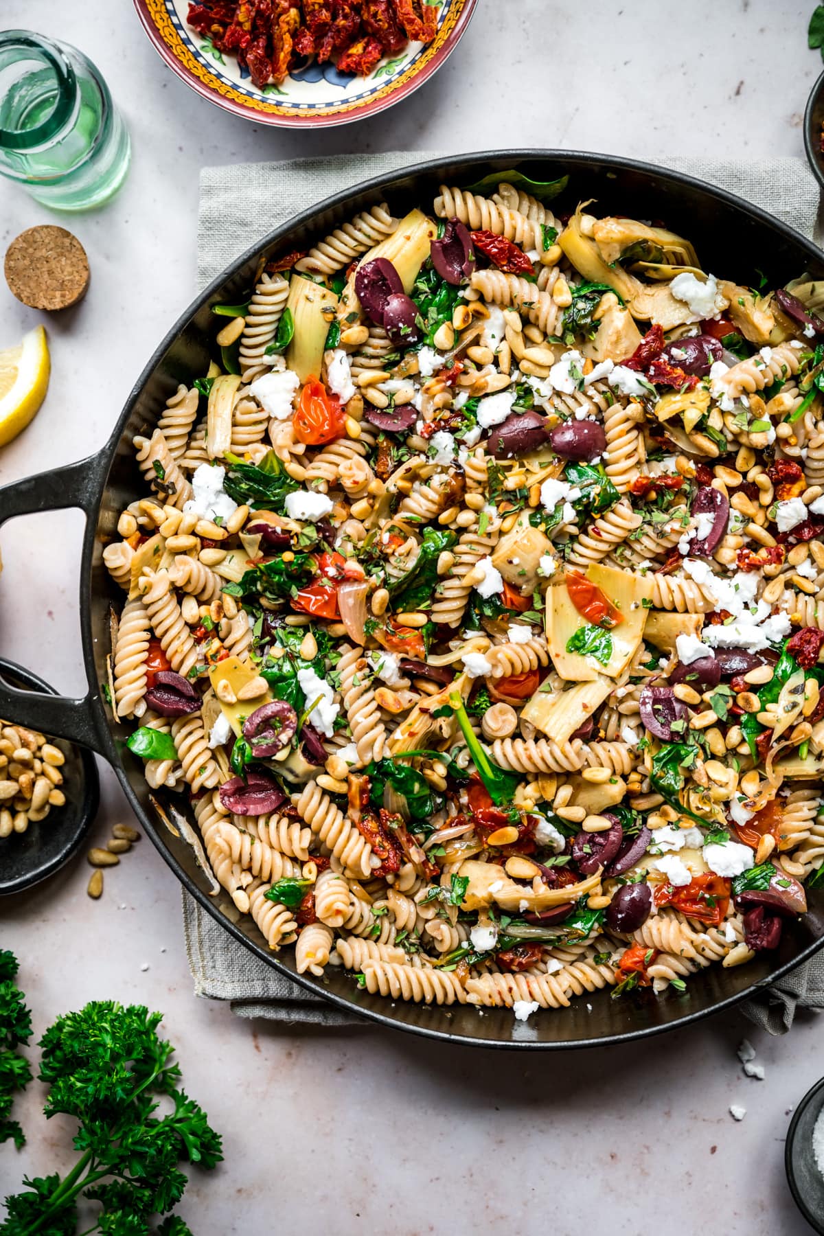 overhead view of vegan greek pasta in a large skillet.