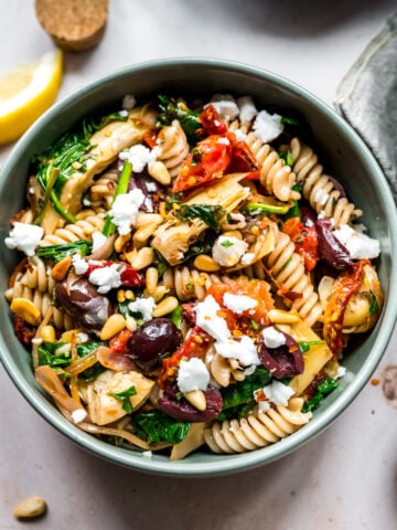 overhead view of vegan greek pasta in a large skillet.