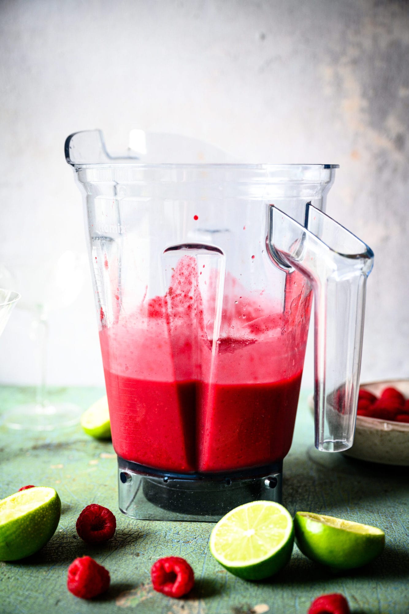 side view of frozen raspberry daiquiri in blender. 