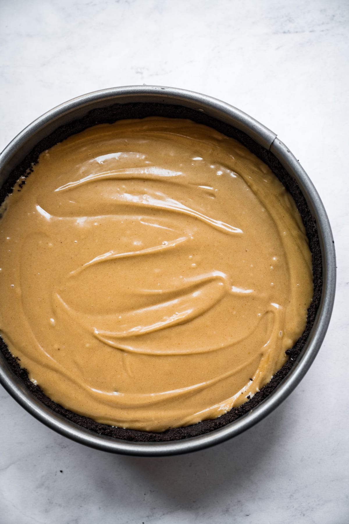 vegan peanut butter pie filling in chocolate cookie crust before chilling. 