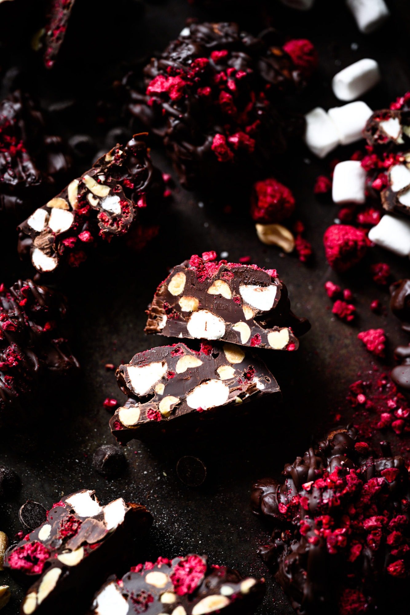 overhead view of vegan chocolate peanut marshmallow clusters with freeze dried raspberries.