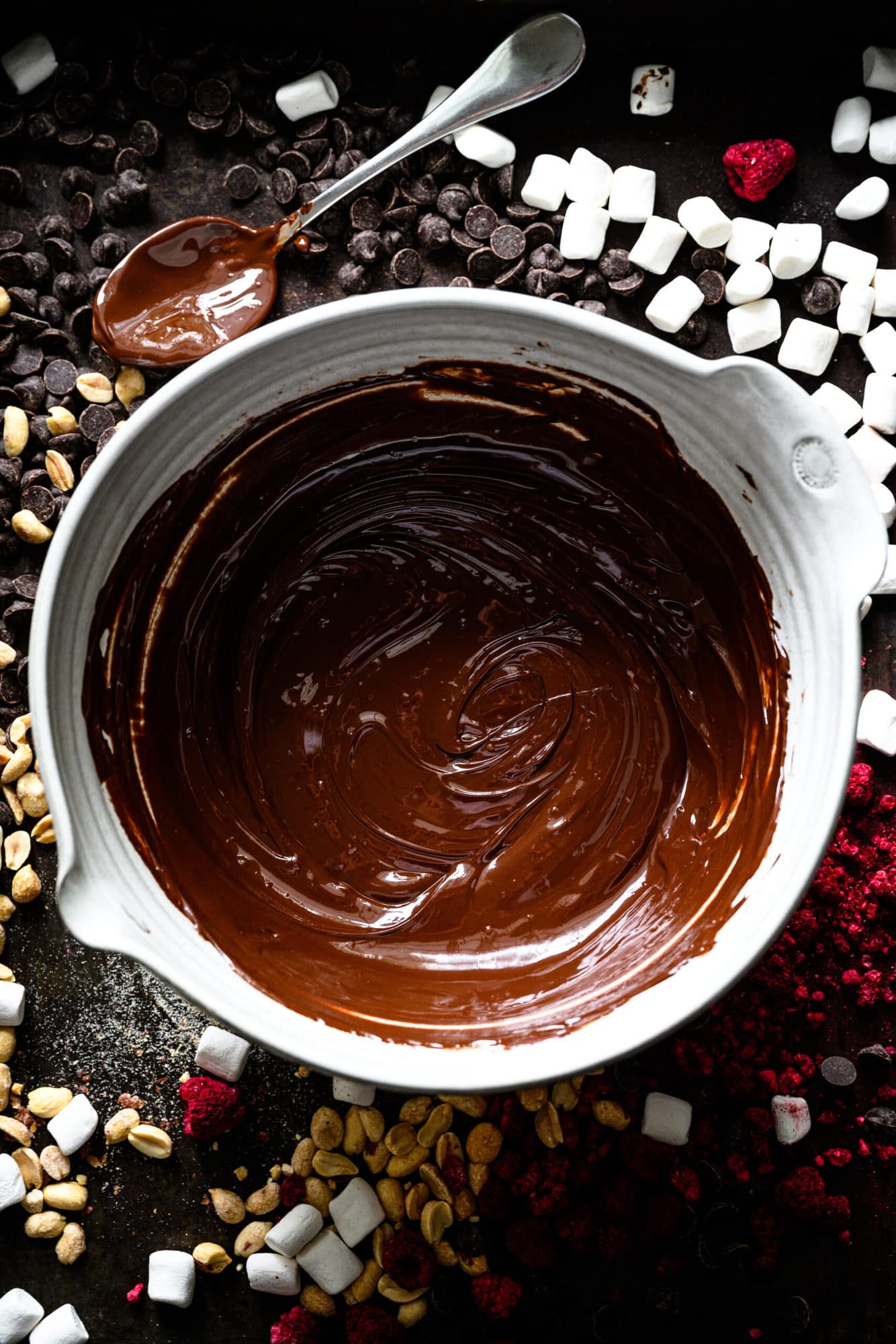 overhead view of melted dark chocolate in a large mixing bowl.