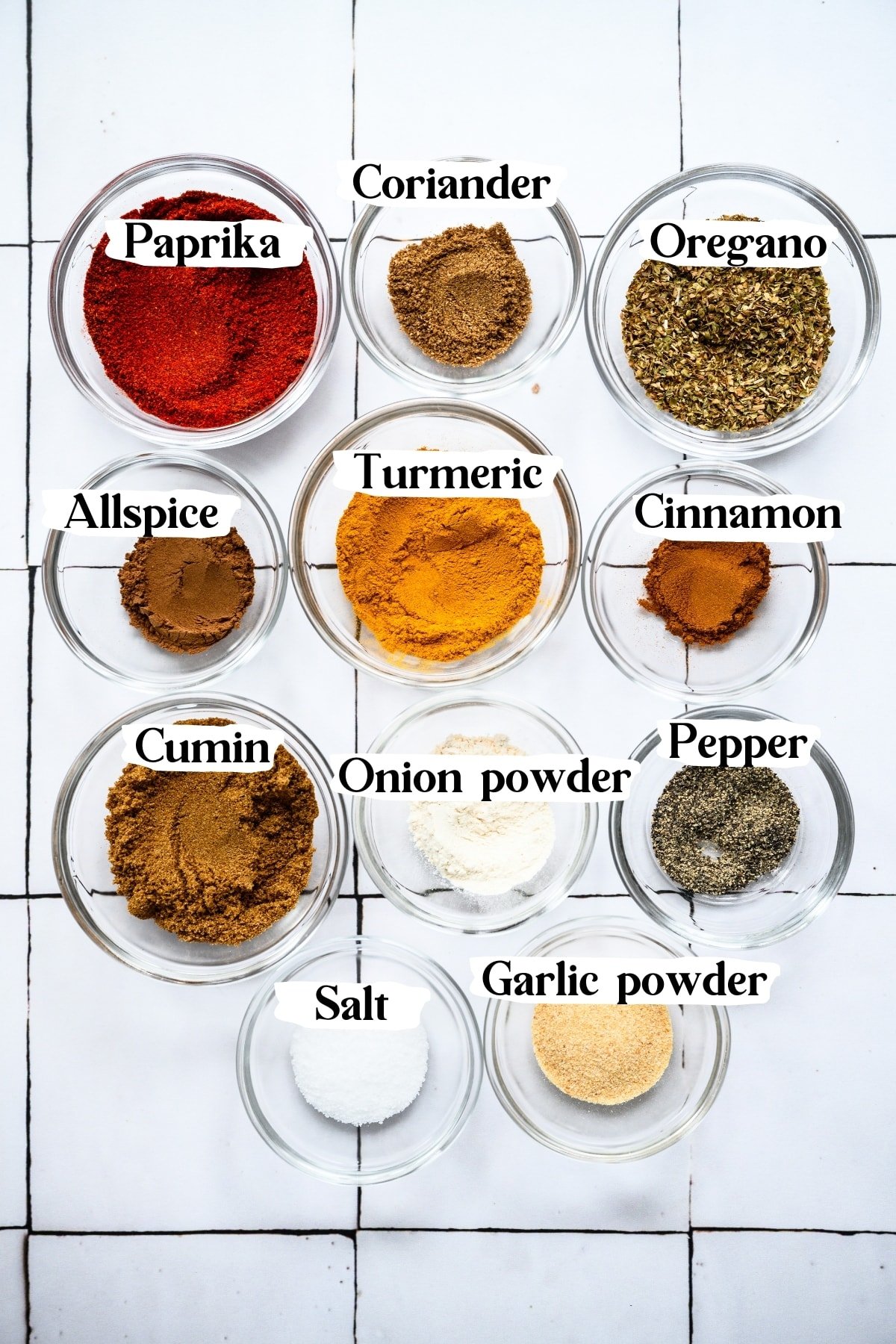overhead view of spices in small bowls for shawarma spice blend. 