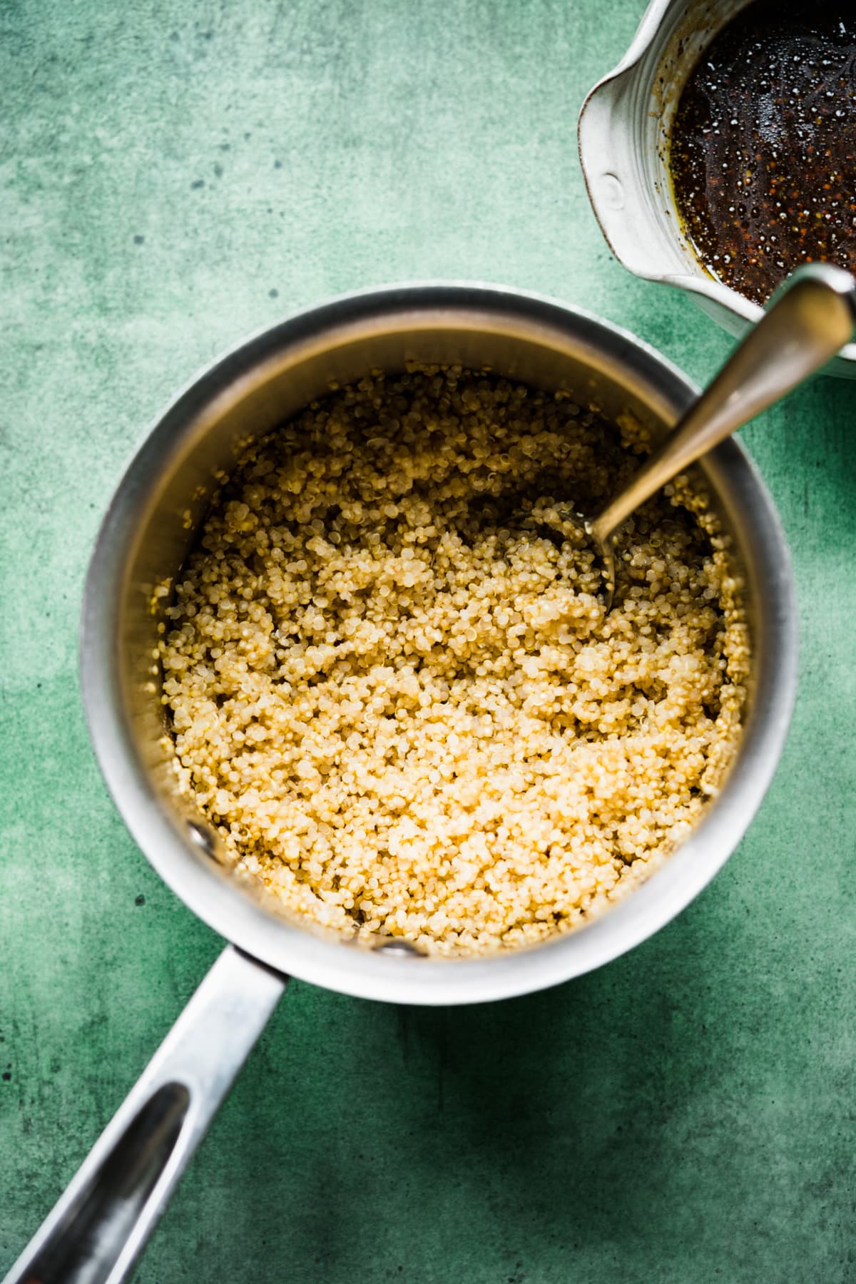 overhead view of cooked quinoa in a small pot.