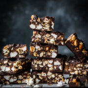stack of salted caramel popcorn chocolate bars sliced into squares.