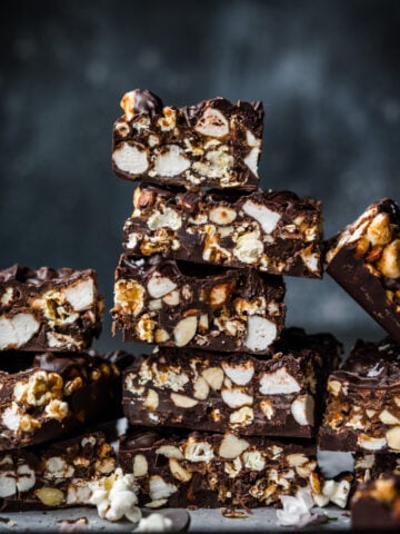stack of salted caramel popcorn chocolate bars sliced into squares.