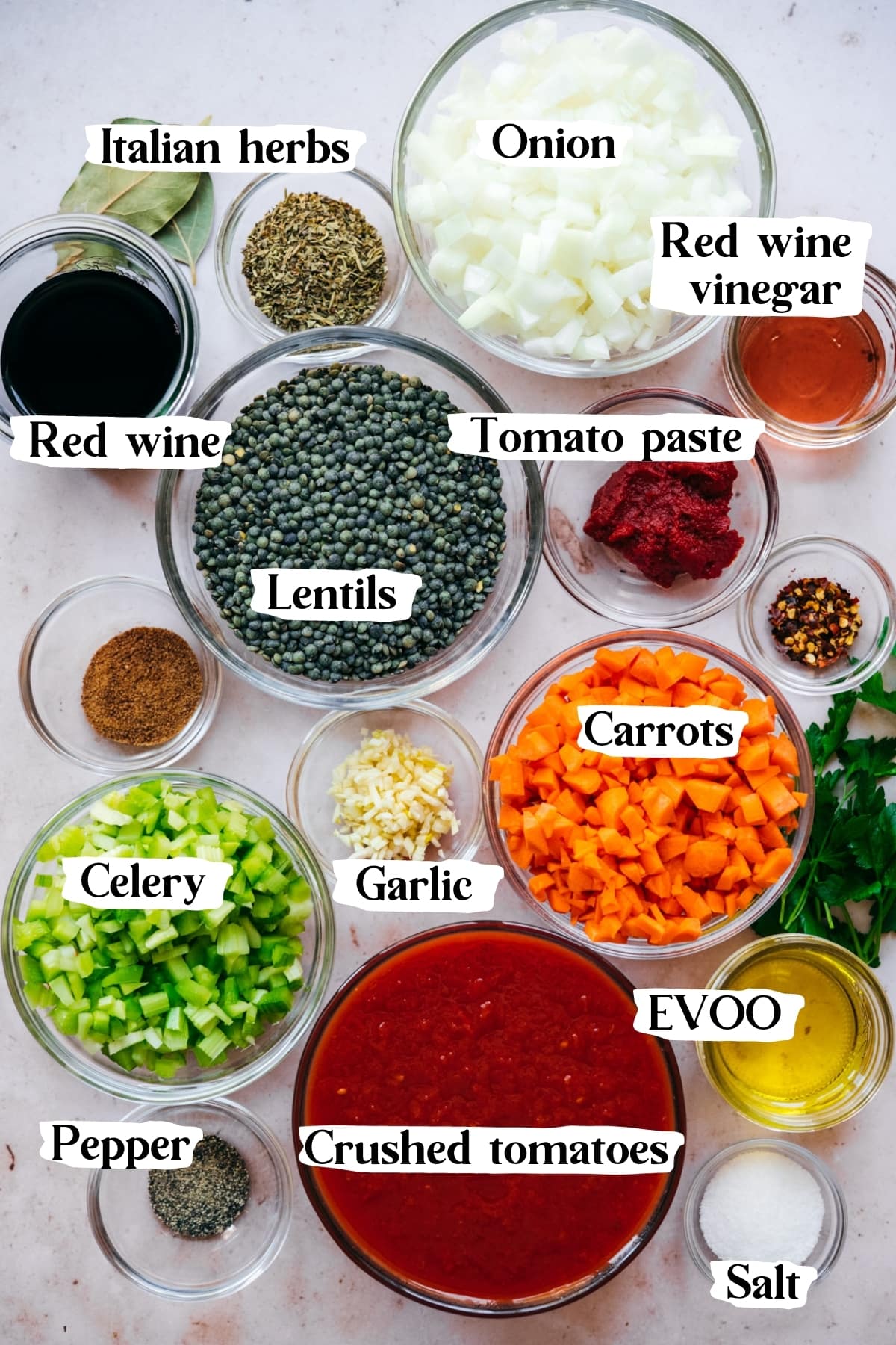 overhead view of ingredients for vegan lentil bolognese in small prep bowls. 