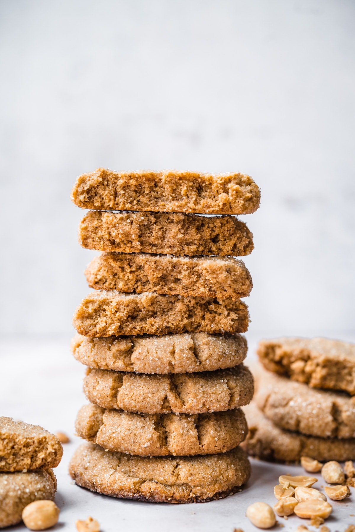 side view of tall stack of vegan peanut butter cookies. 