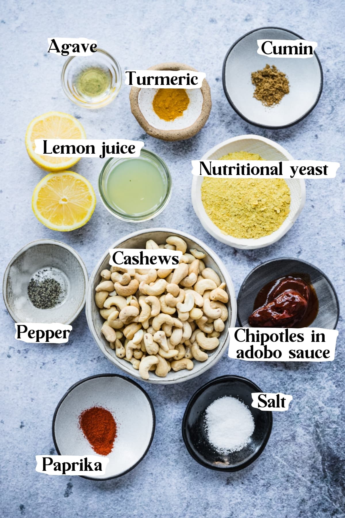 overhead view of ingredients for vegan queso dip in small bowls. 