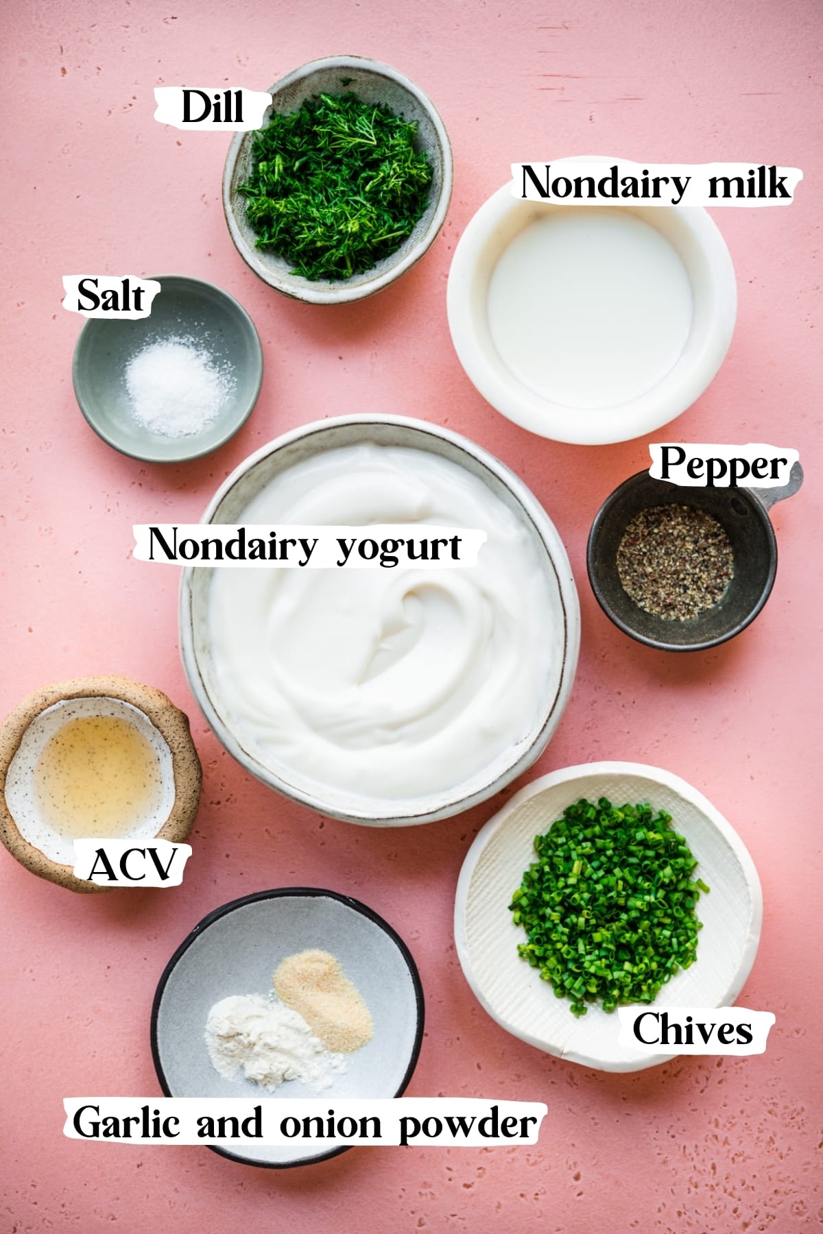 overhead view of ingredients for vegan ranch dip in small prep bowls. 