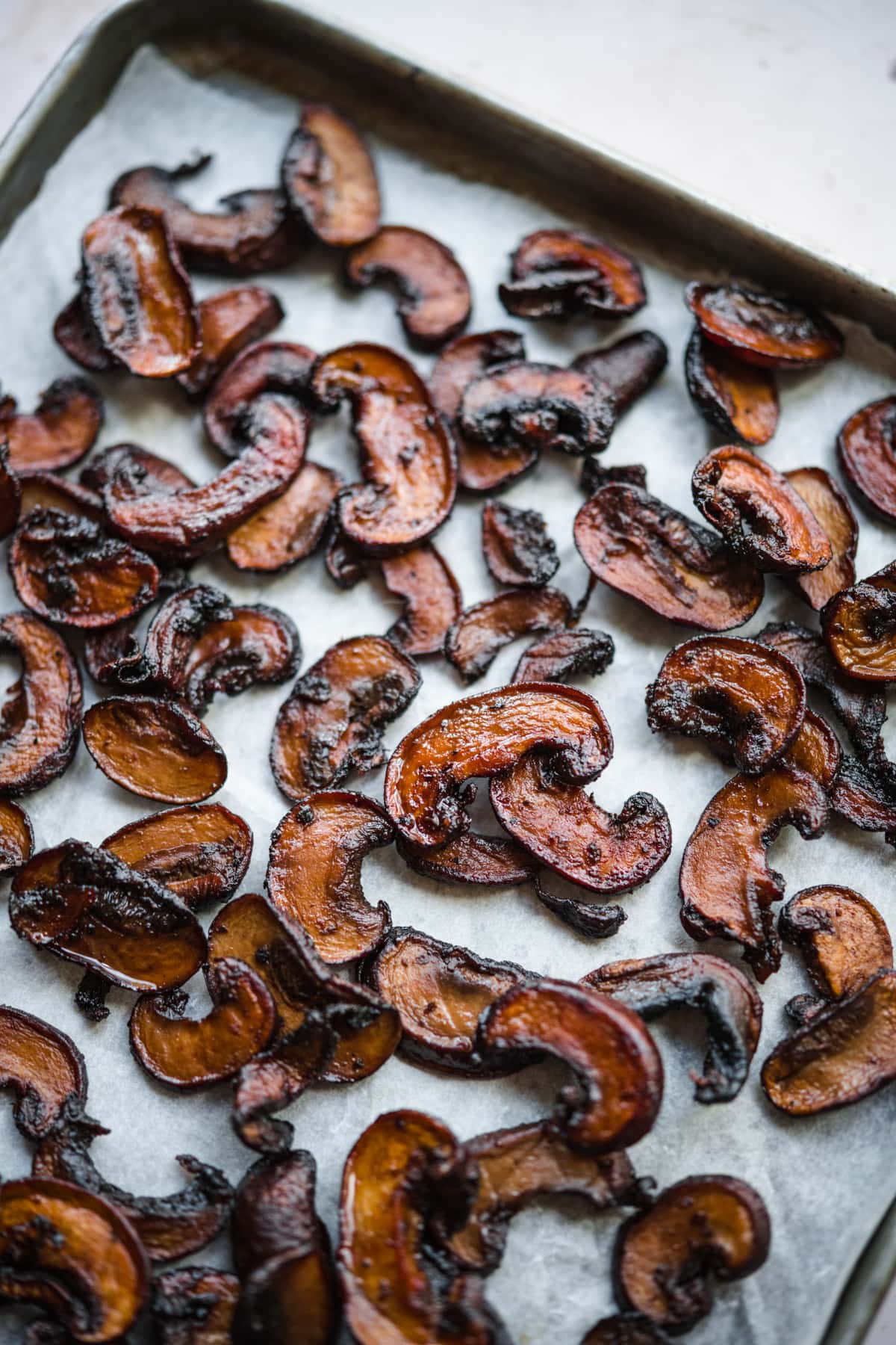 close up view of mushroom bacon on a sheet pan. 