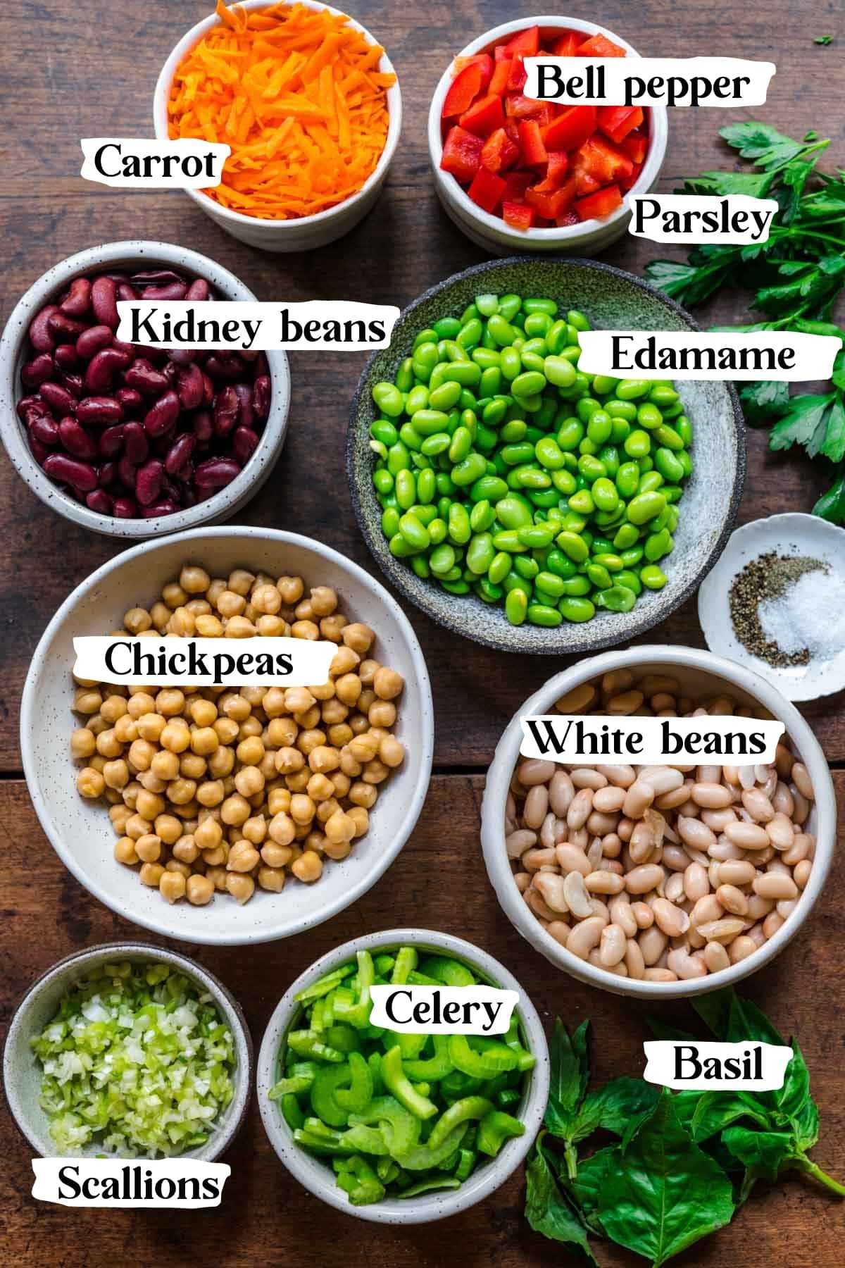 overhead view of ingredients for four bean salad in small prep bowls. 