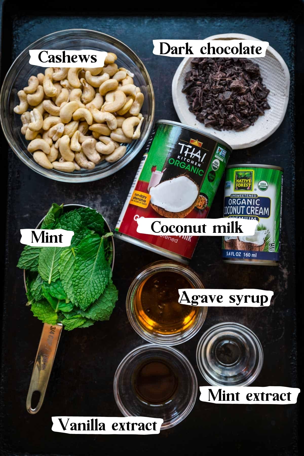 overhead view of ingredients for vegan mint chocolate chip ice cream on sheet pan. 