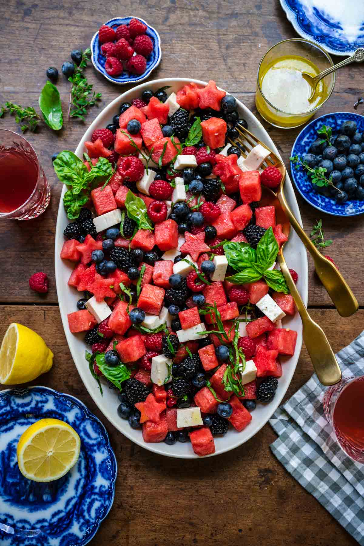  close up overhead view of red white and blue fruit salad on a platter. 