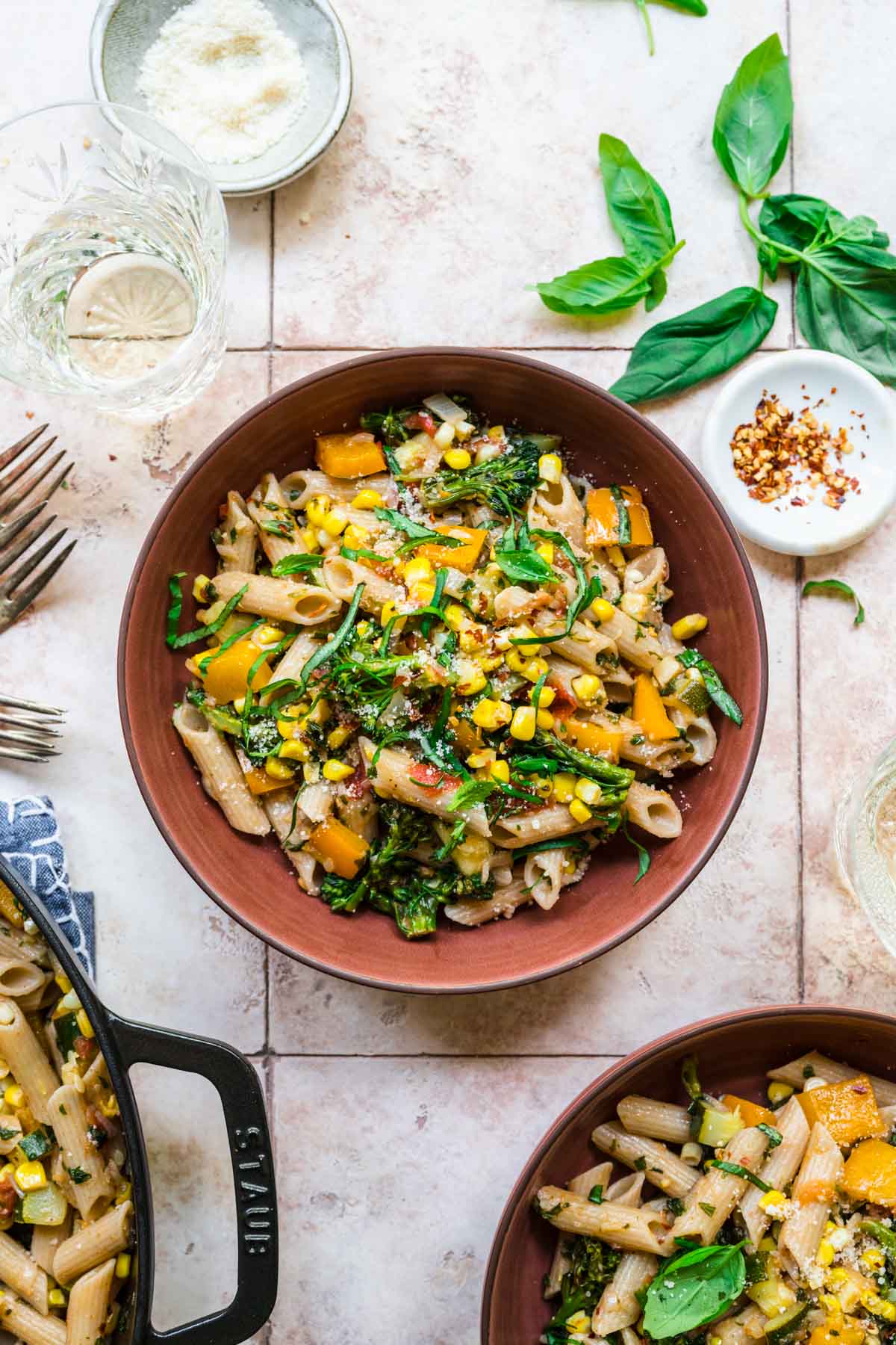 This vegan pasta recipe is packed with our favorite summer vegetables like zucchini and corn. Best of all, this recipe comes together with just one pot and one pan.