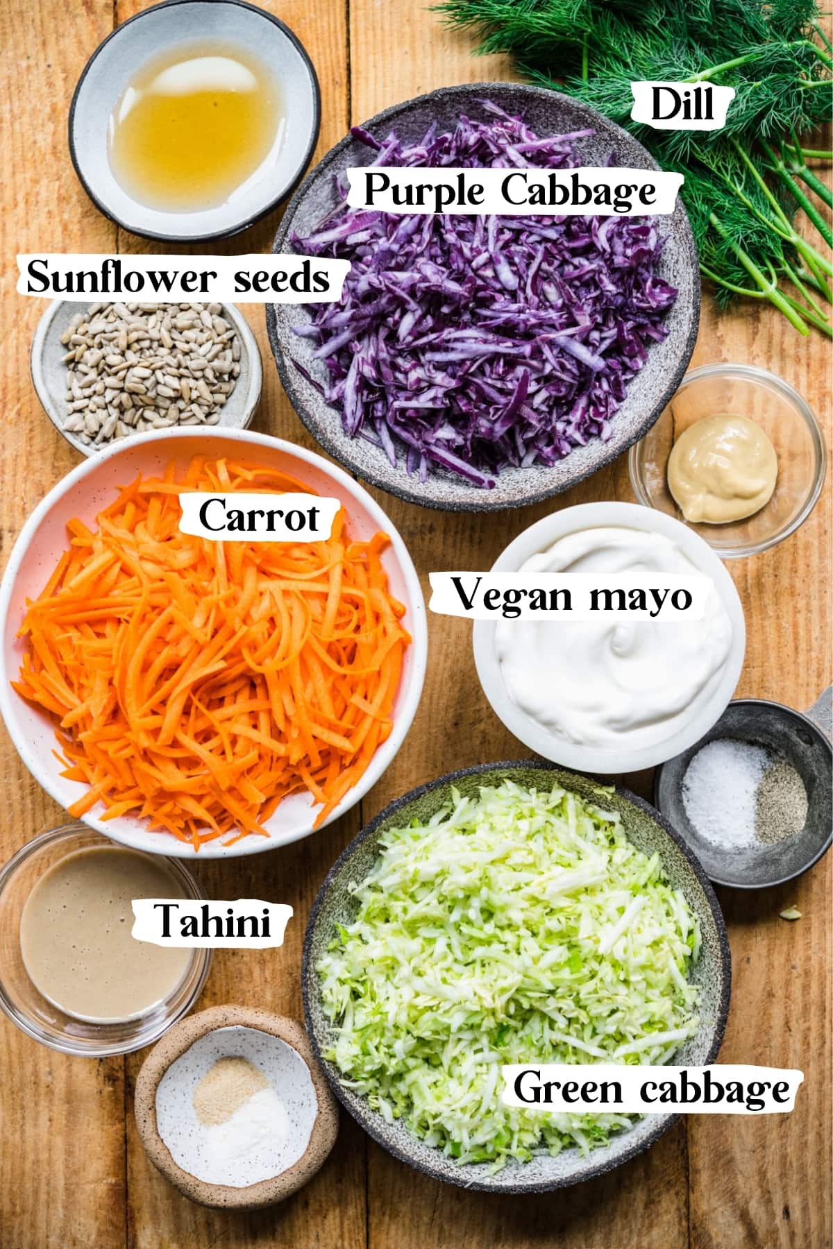 overhead view of ingredients for vegan coleslaw in small prep bowls. 