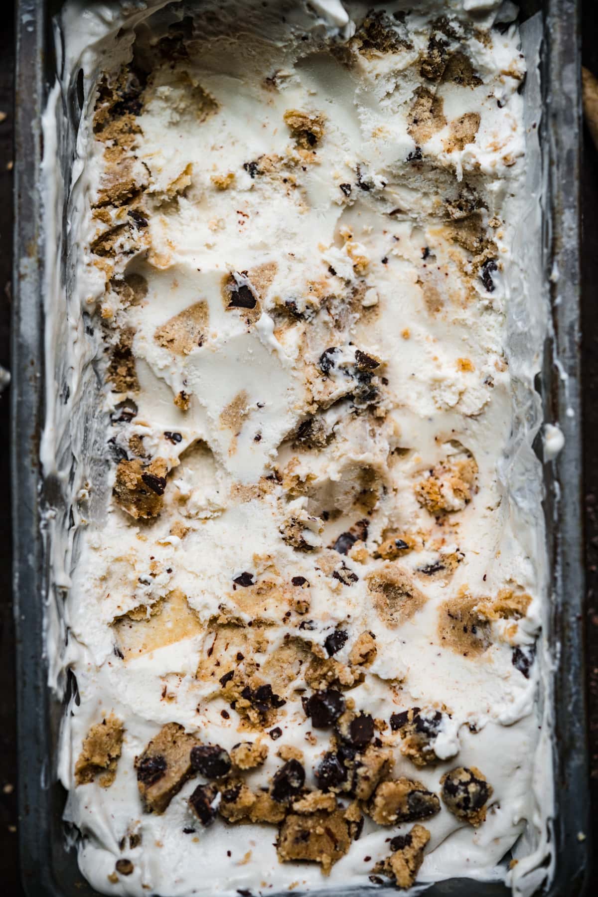 overhead view of vegan cookie dough ice cream in antique tin.