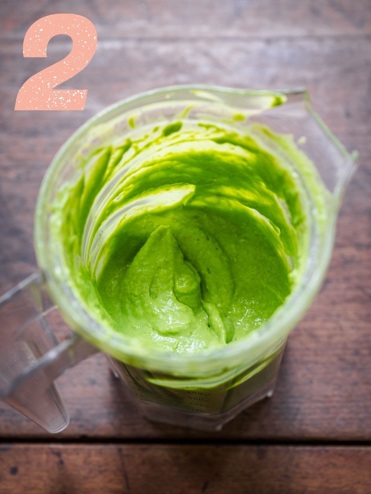 Overhead shot of the green goddess dressing in a food processor.