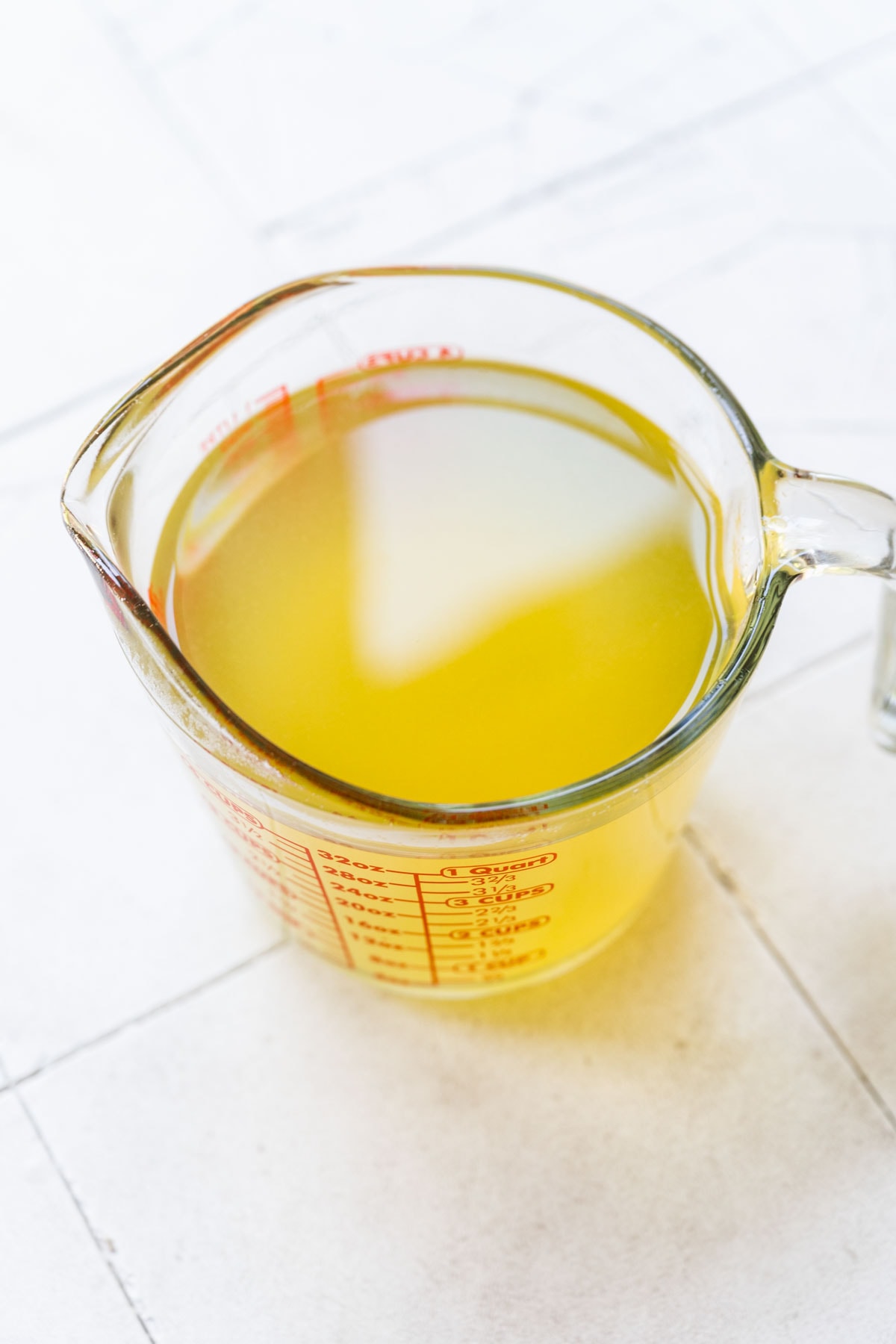 Overhead view of a measuring cup full of the finished corn stock.