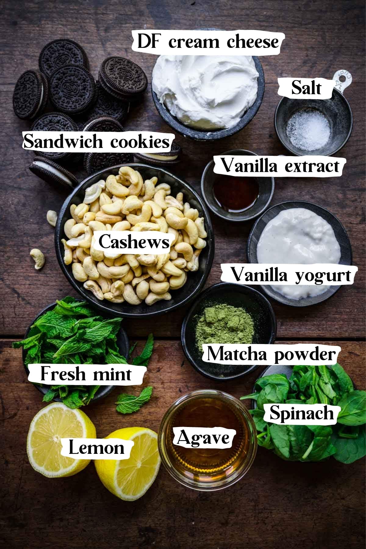 Overhead shot of cheesecake ingredients, including cream cheese, cashews, and cookies.