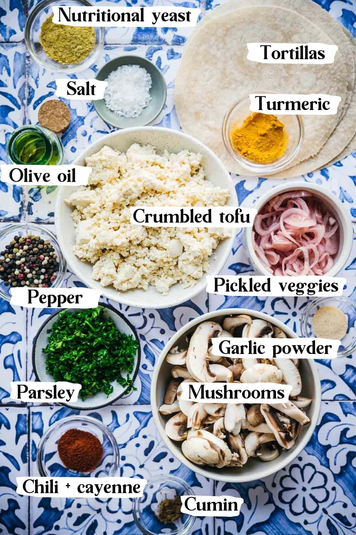 Picture of all the ingredients used in this recipe, including tofu, mushrooms, spices, etc.