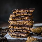 Front view of stacked pieces of chocolate sesame bark.